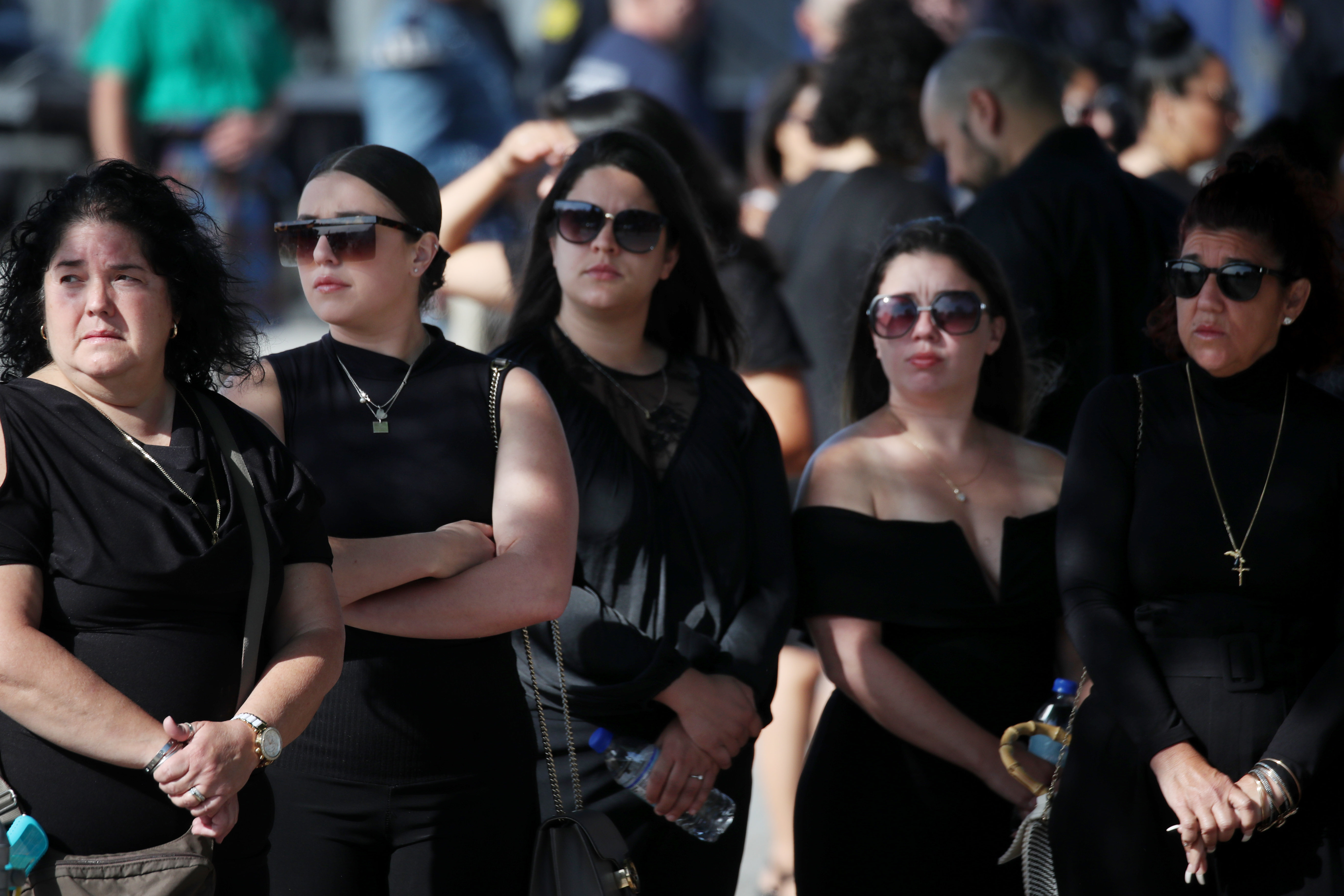 Mourners waited for the procession before a funeral service for Worcester police Officer Enmanuel "Manny" Familia.