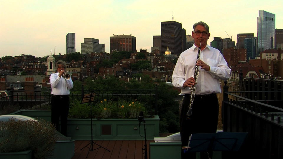 Boston Landmarks player Dana Oakes, on trumpet, and Andrew Price, on English horn, recorded solos on a Beacon Hill rooftop.