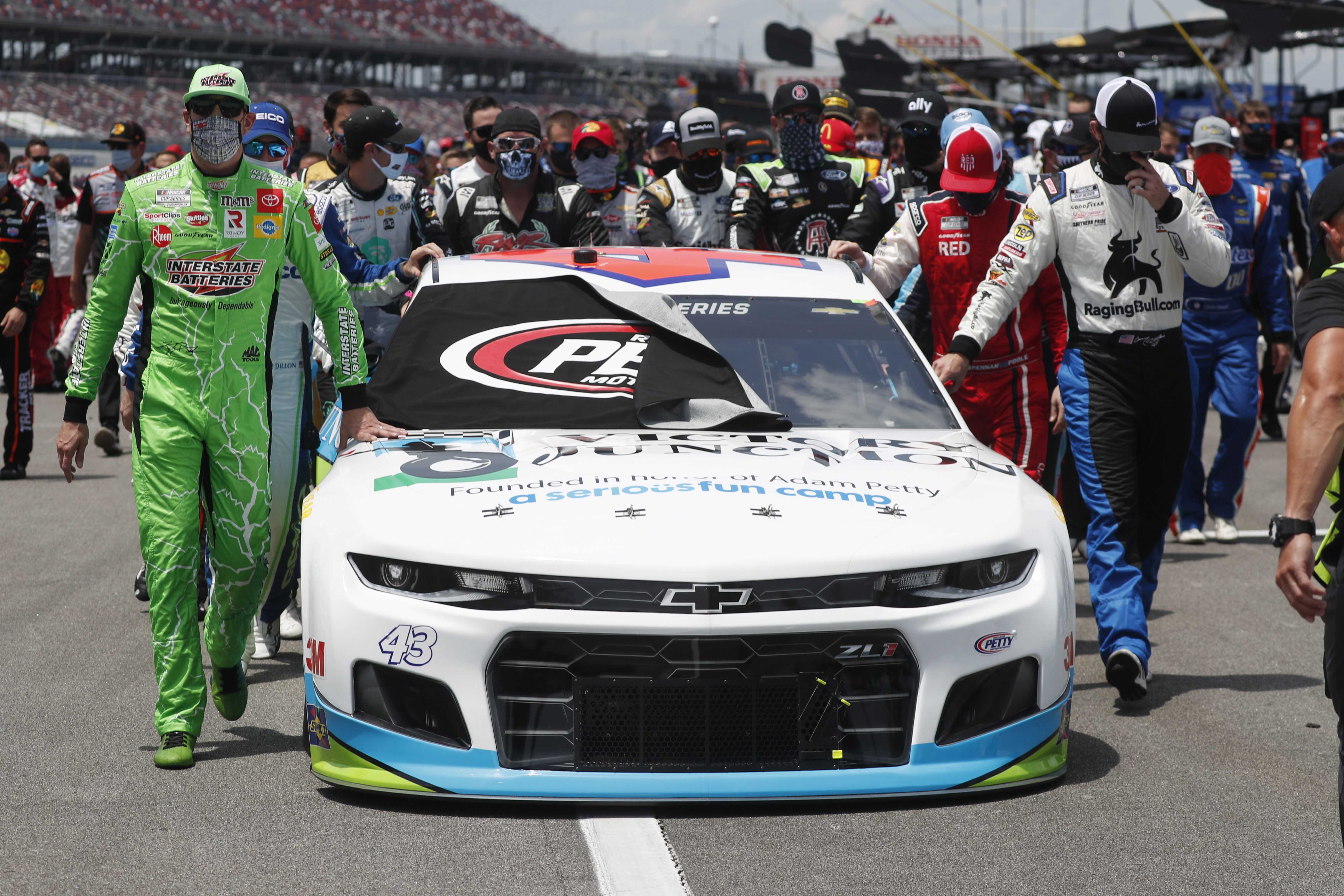 Watch NASCAR drivers push Bubba Wallaces car to the front of field before race in show of support