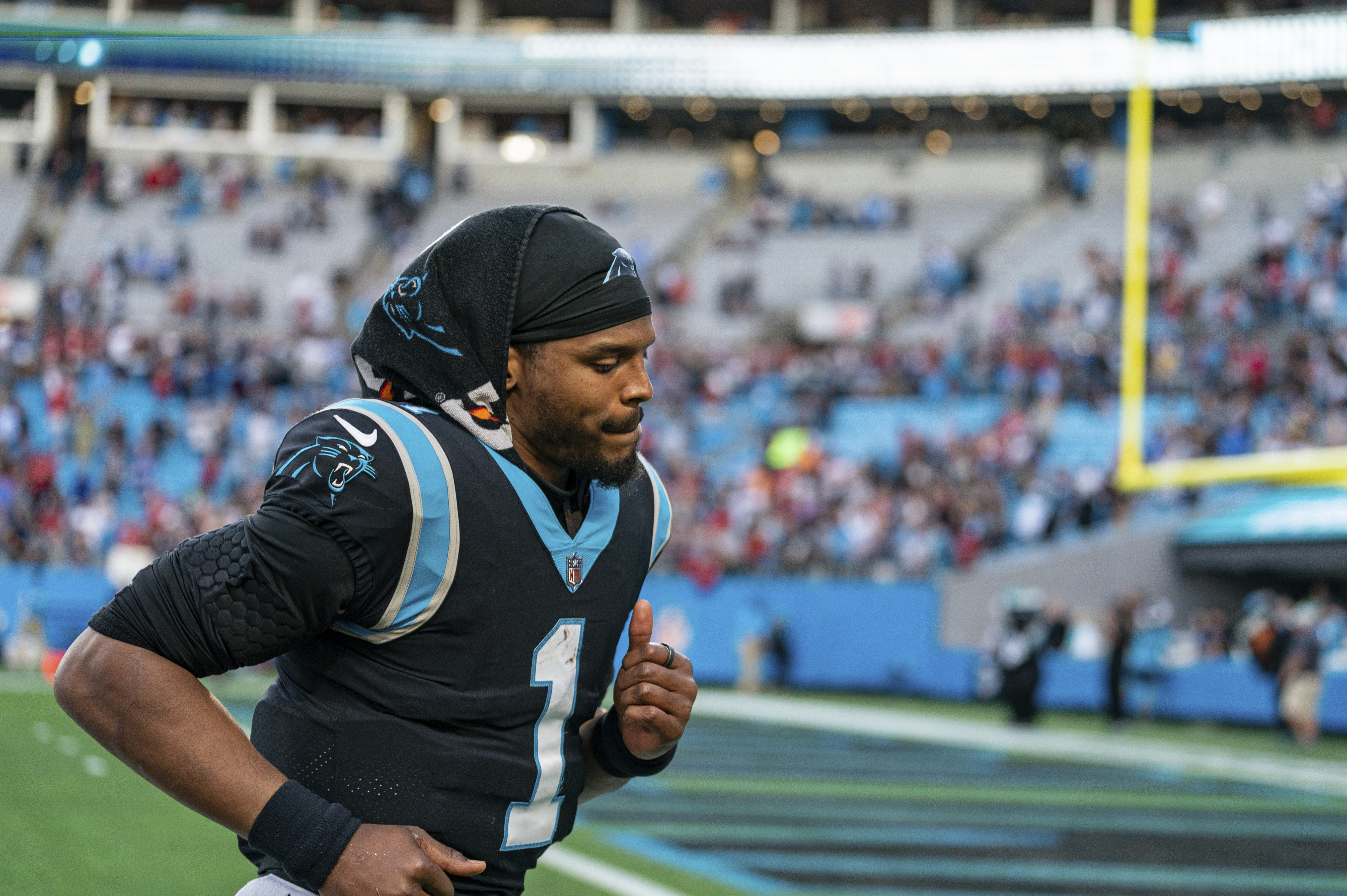 Carolina Panthers quarterback Cam Newton (1) runs on the field