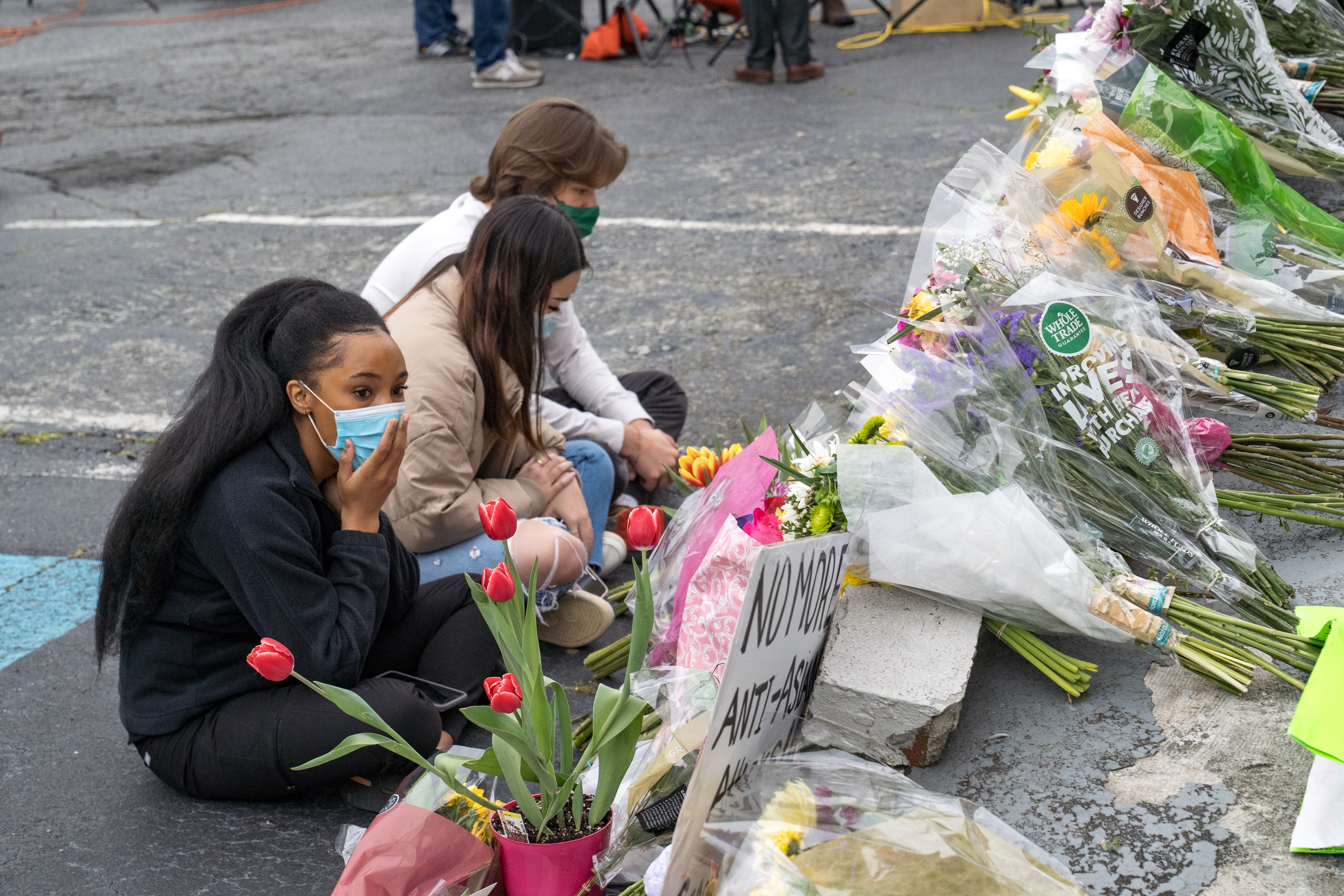 Young mourners at the memorial sight set up outside of The Gold Spa on March 19, 2021 in Atlanta, Georgia.
