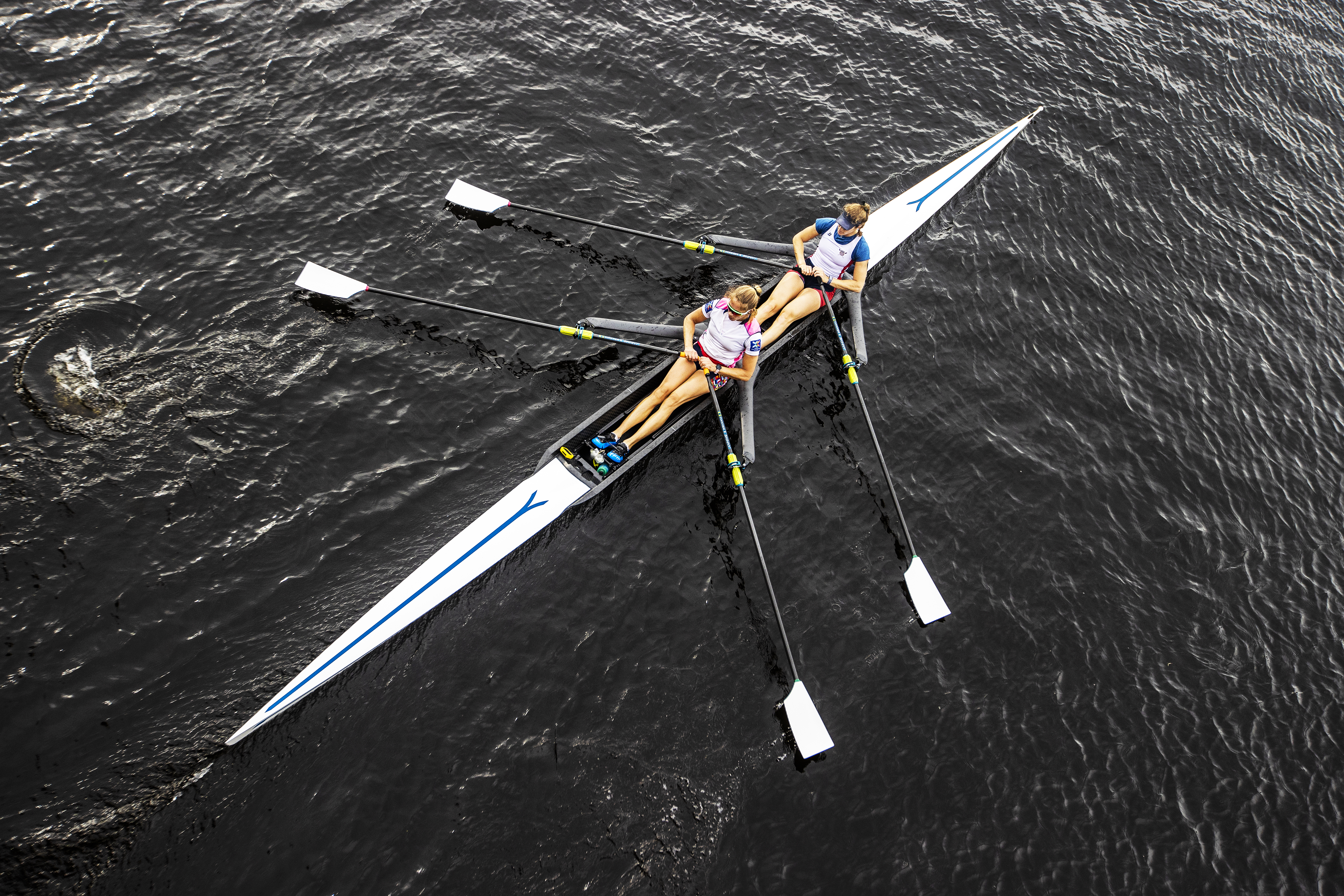 Stone and Wagner are in perfect sync as they go under the Eliot Bridge on the Charles.