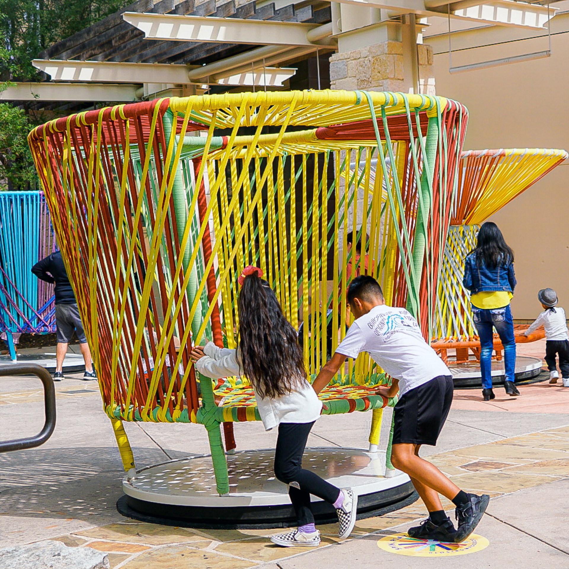 Children playing on The Lawn at Oakbrook Center