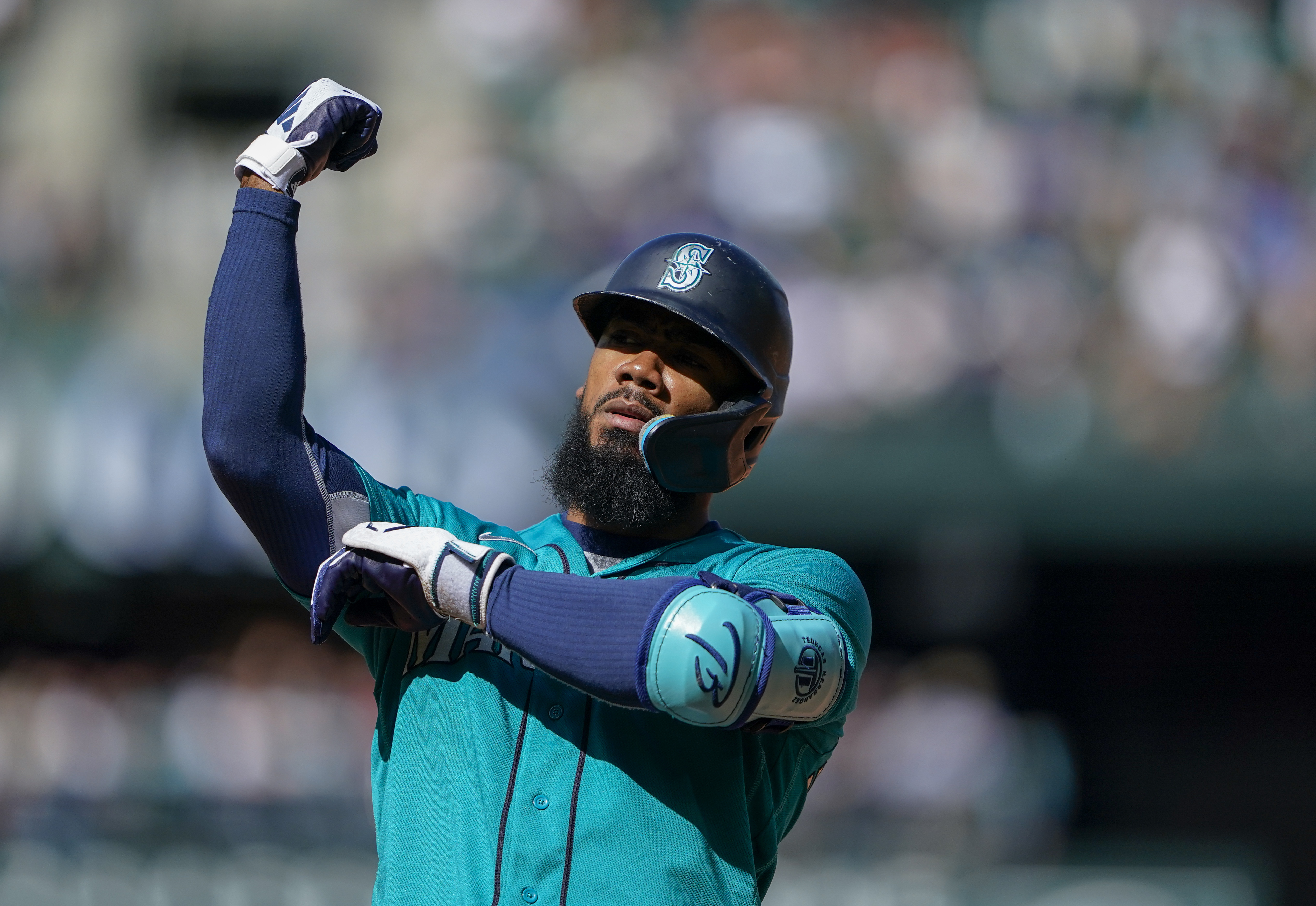 ANAHEIM, CA - JUNE 10: Seattle Mariners center fielder Julio Rodriguez (44)  raises a trident in the air after hitting a two run home run during an MLB  baseball game against the