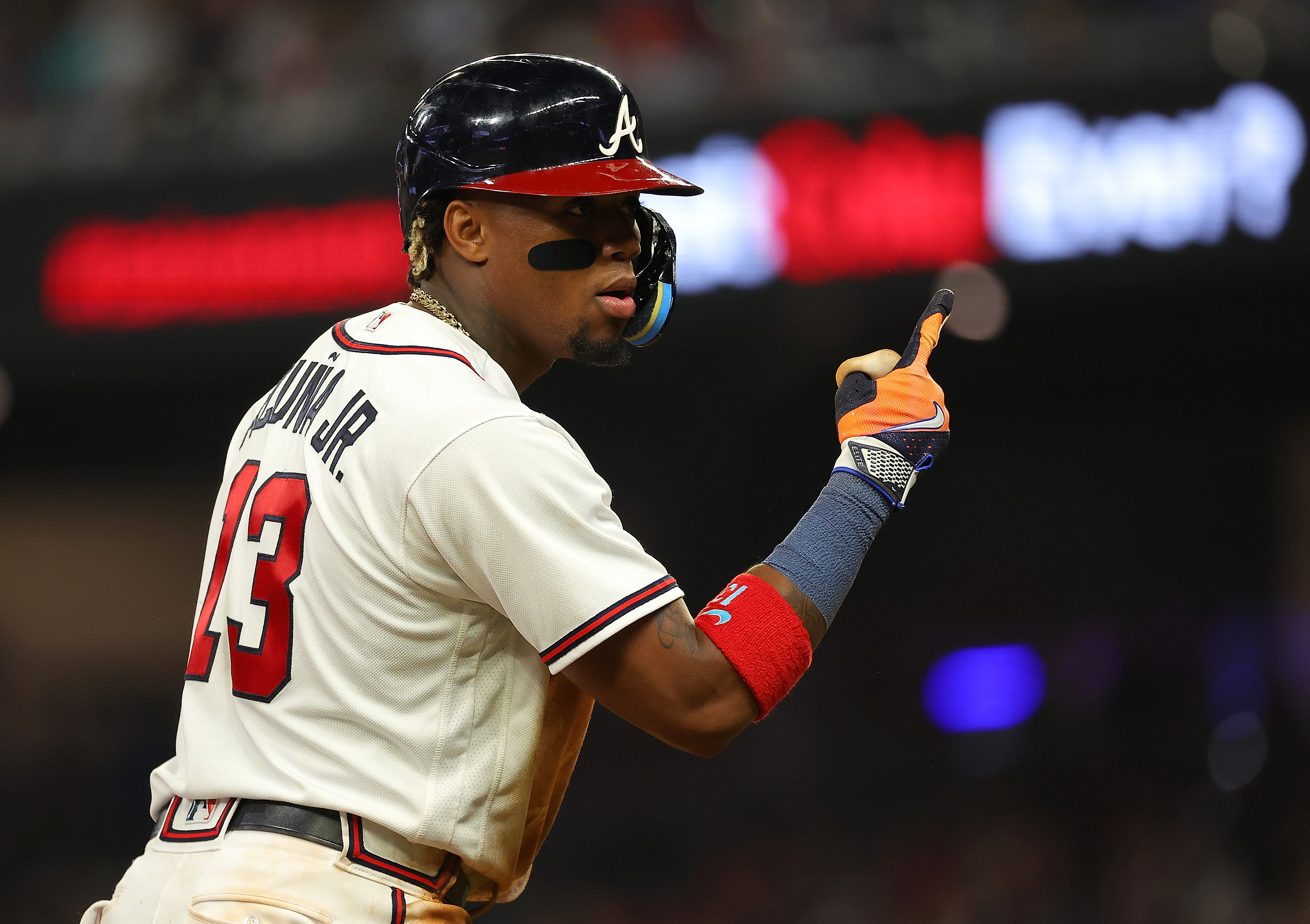 Ronald Acuna Jr. #13 of the Atlanta Braves reacts after hitting a