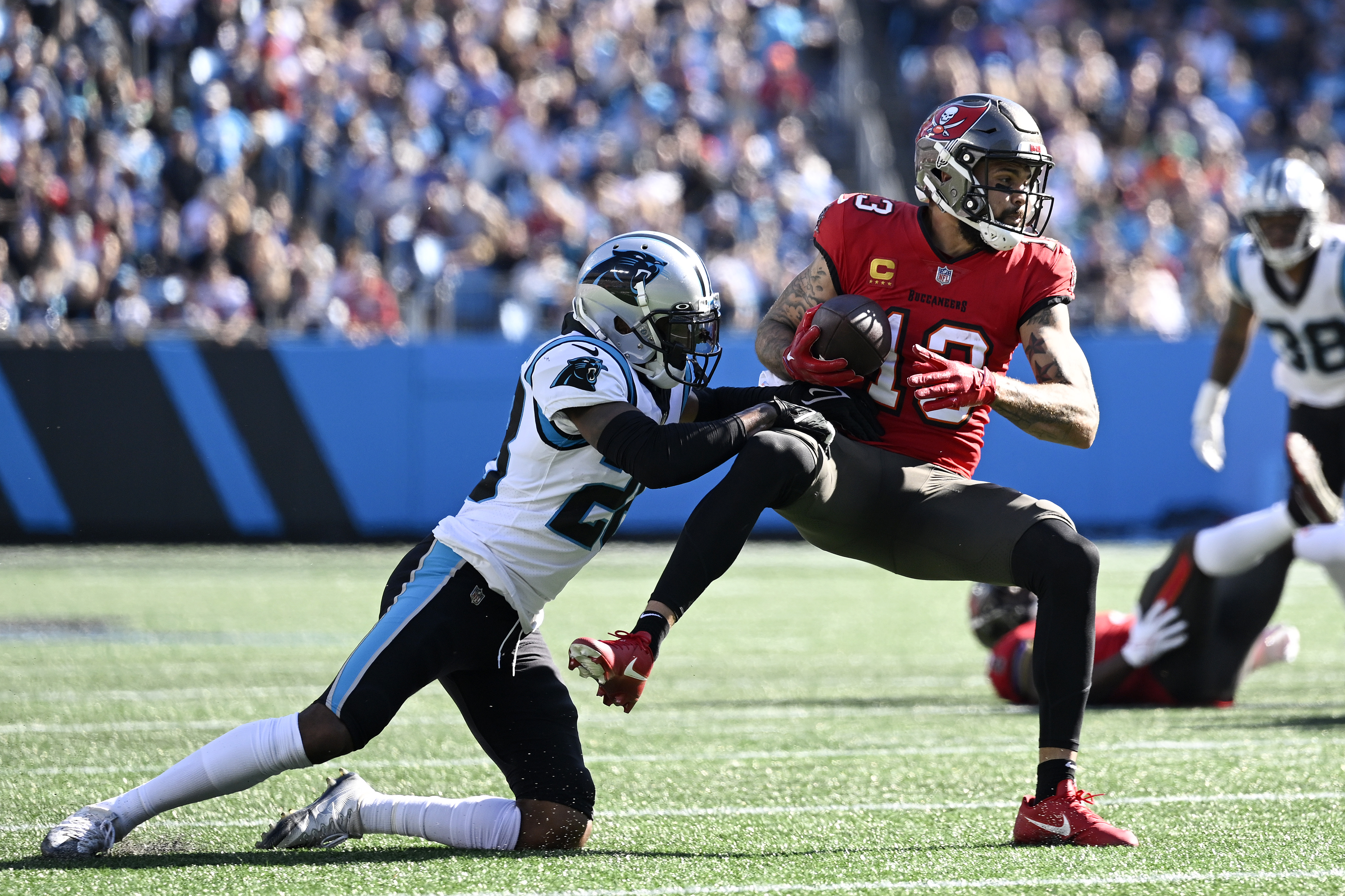 Carolina Panthers running back Chuba Hubbard (30) takes a handoff from  quarterback PJ Walker (11) during an NFL football game against the Tampa  Bay Buccaneers on Sunday, Oct. 23, 2022, in Charlotte