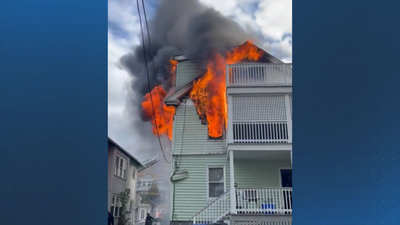 Flames shoot from windows as Boston firefighters battle blaze at