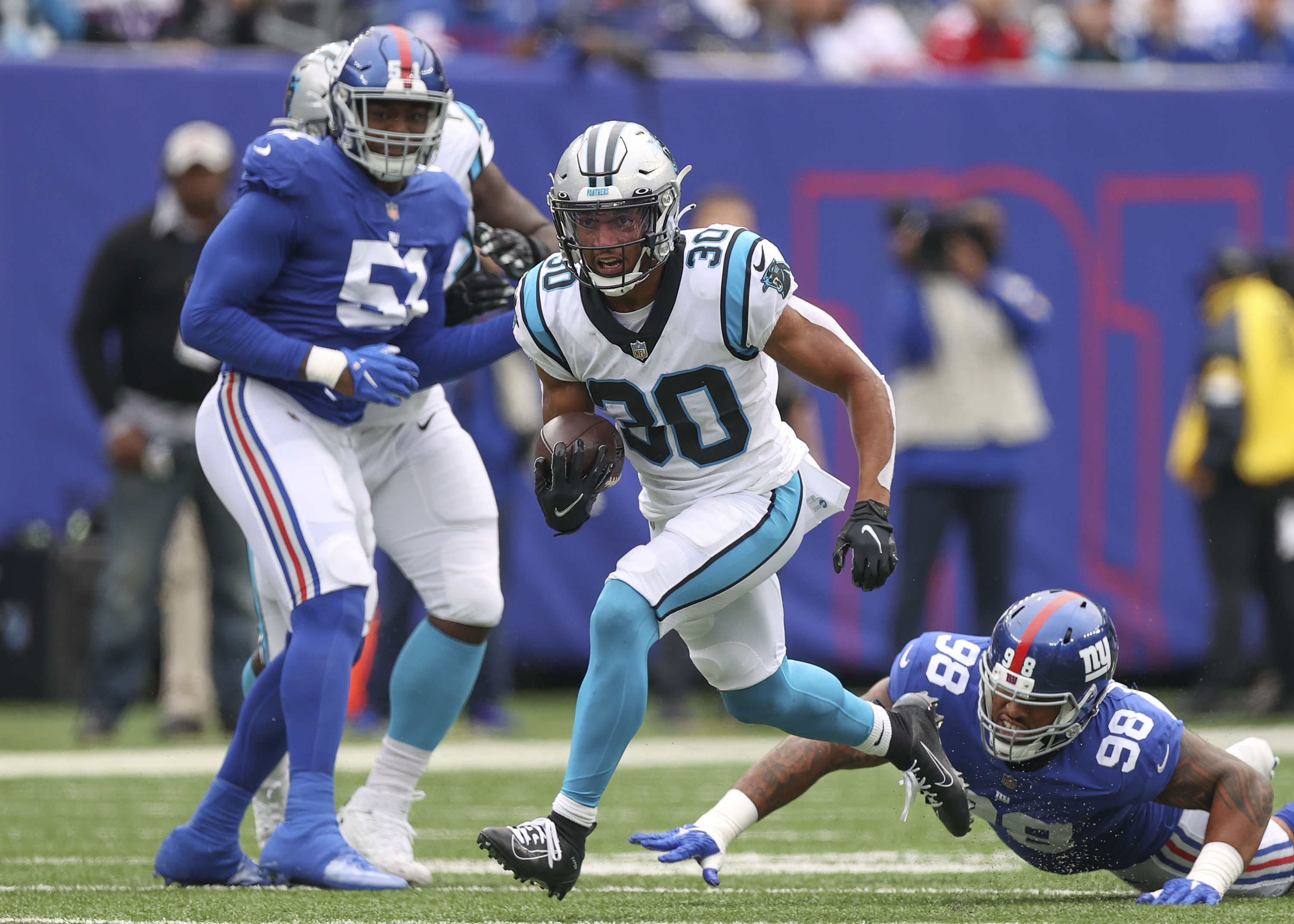 Jones passing and catching, Giants D spark win over Panthers