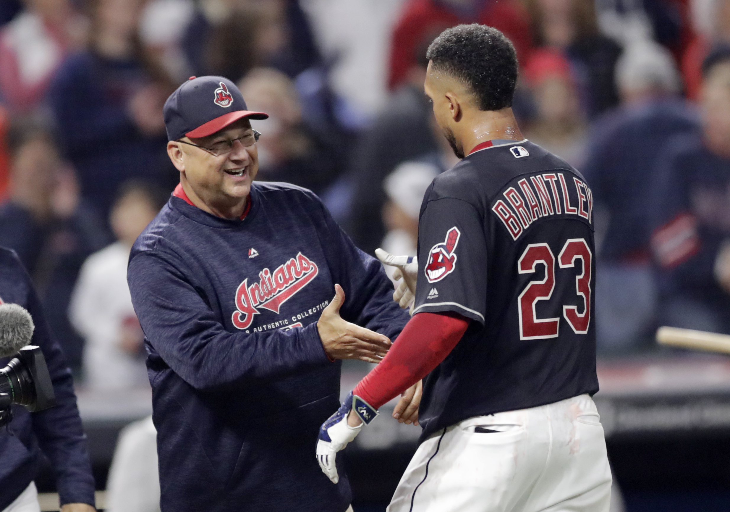 Boston Red Sox manager Terry Francona, left, grabs the shirt of