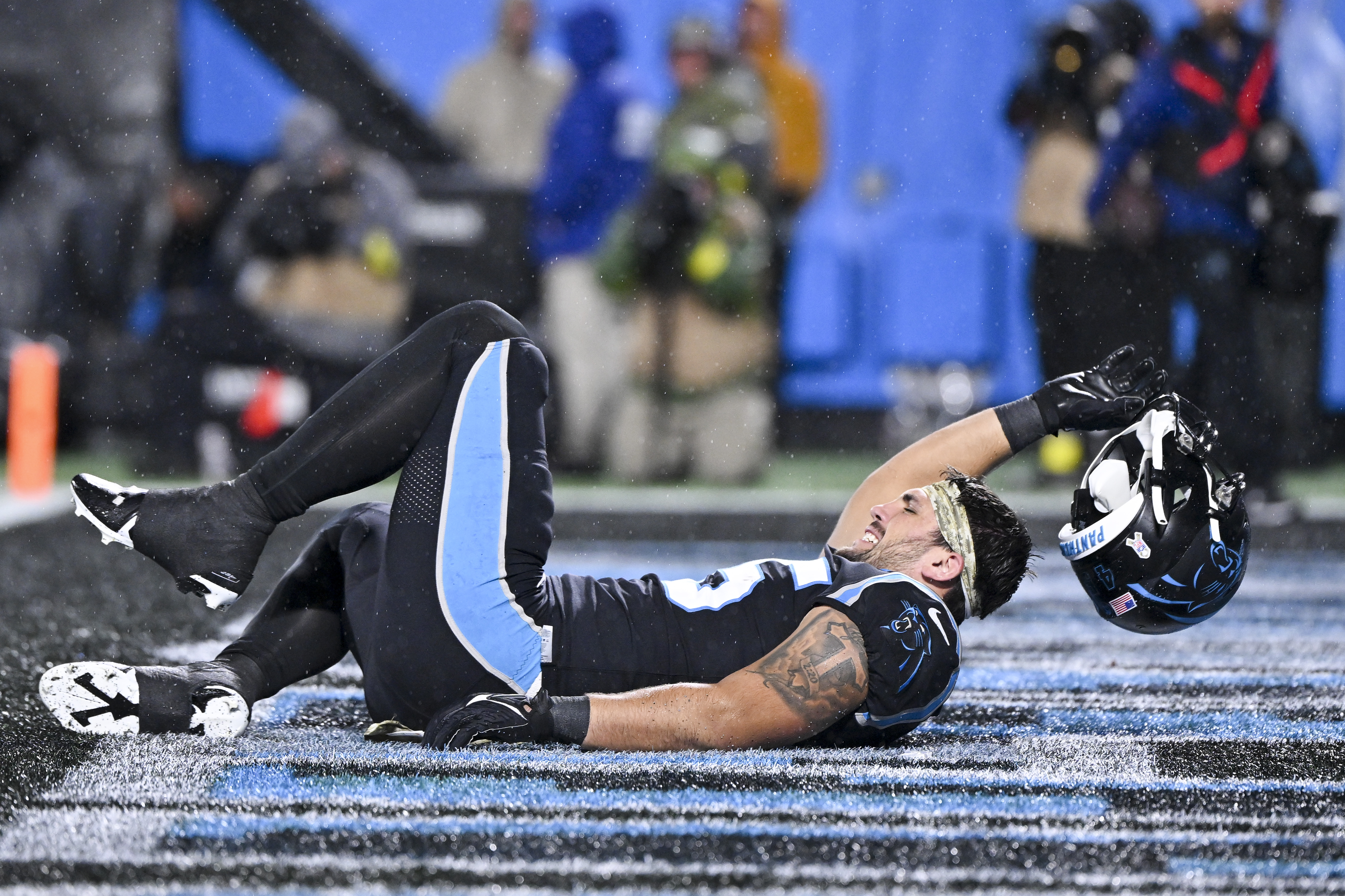 Foreman leads Panthers past rival Falcons in rain, 25-15