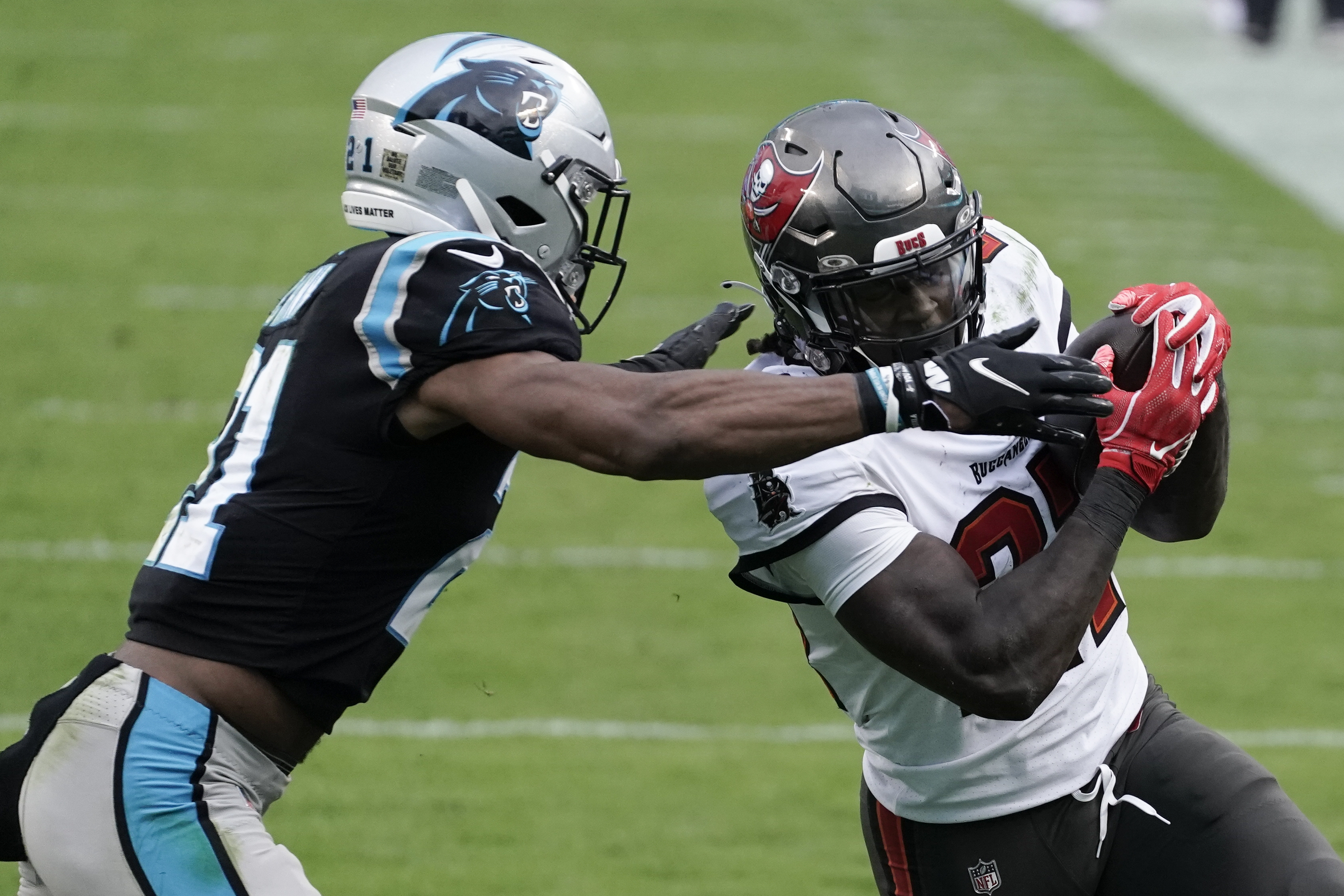 Carolina Panthers linebacker Shaq Thompson (7) reacts after making a play  on defense during an NFL football game against the Atlanta Falcons,  Thursday, Nov. 10 2022, in Charlotte, N.C. (AP Photo/Brian Westerholt