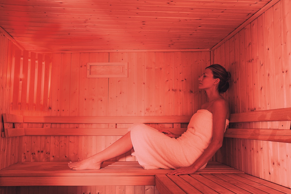 Woman relaxing in sauna