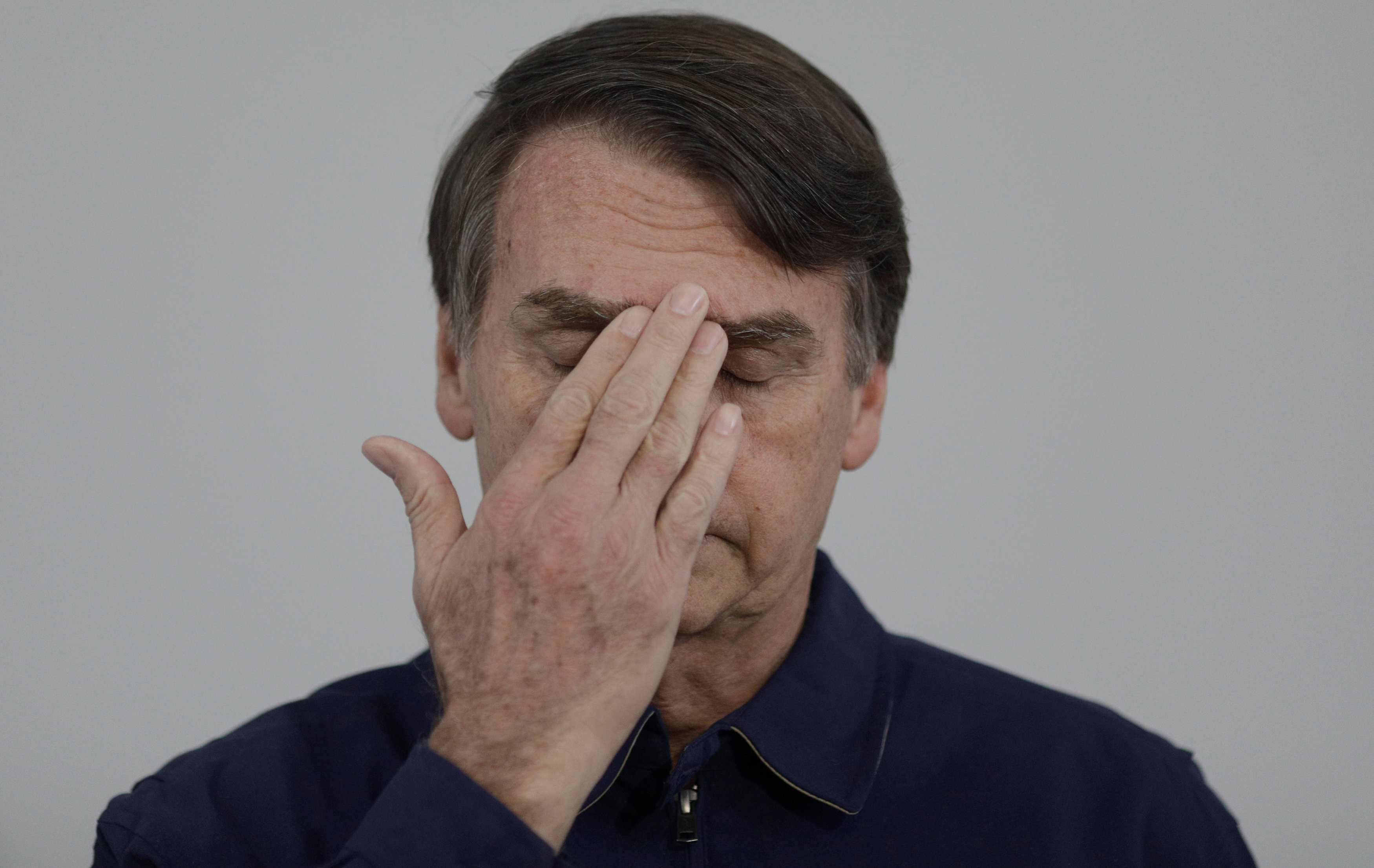 Presidential candidate Jair Bolsonaro gestures during a news conference at a campaign office in Rio de Janeiro