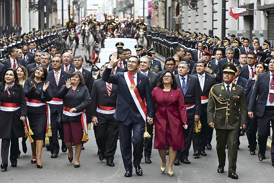 Peru's-President-Martin-Vizcarra-and-his-wife-and-first-lady-Maribel-Cabello-walk-together-after-Vizcarra--delivered-his-annual-address-in-Congress,-in-Lima-(46306694)