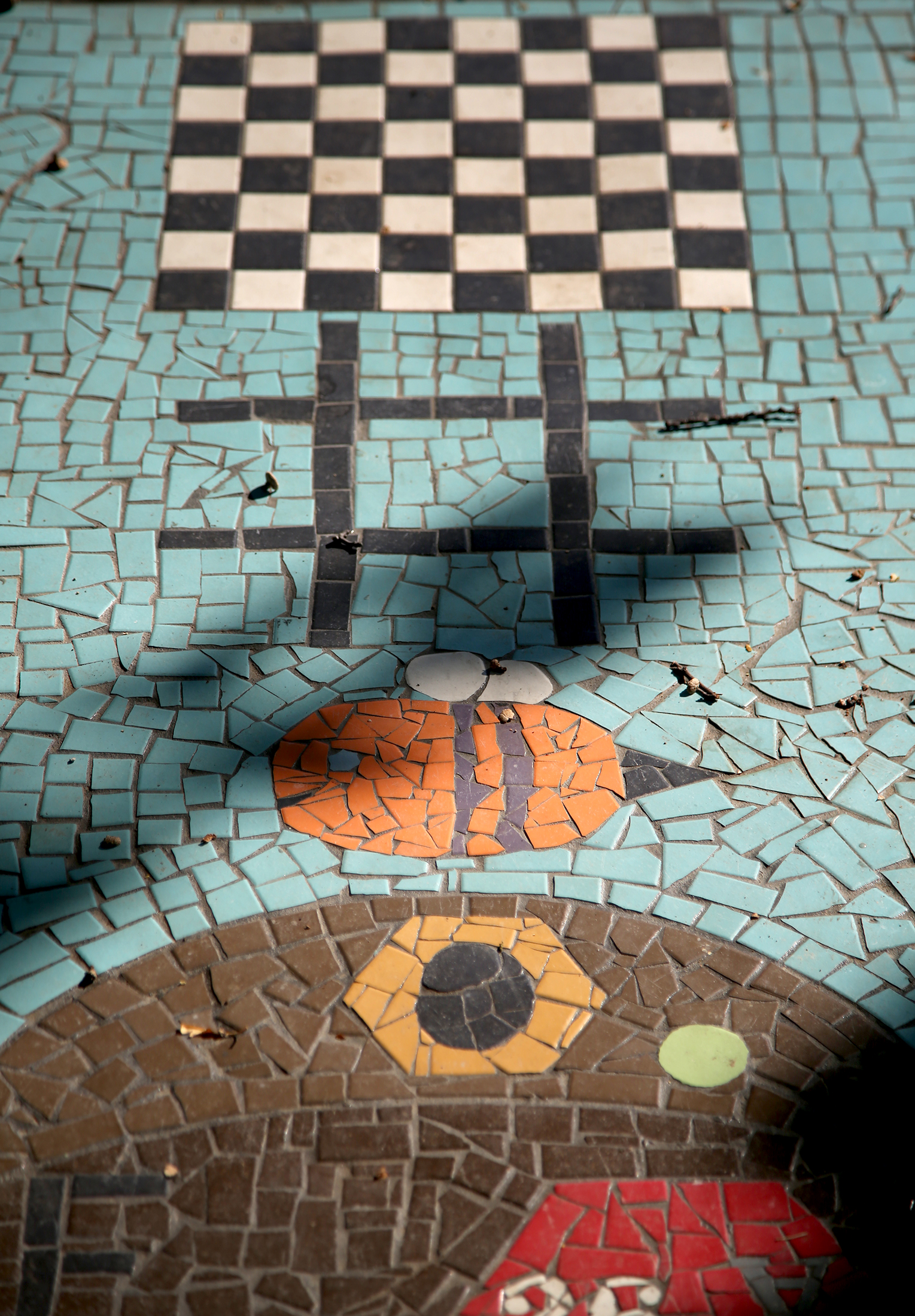 âBee Ambitiousâ is a public artwork scattered throughout the Haverstick neighborhood. The hub of the game, a 29-foot-long beehive made from mosaics on Mendota Court, was created with nine games within it. LISA POWELL / STAFF