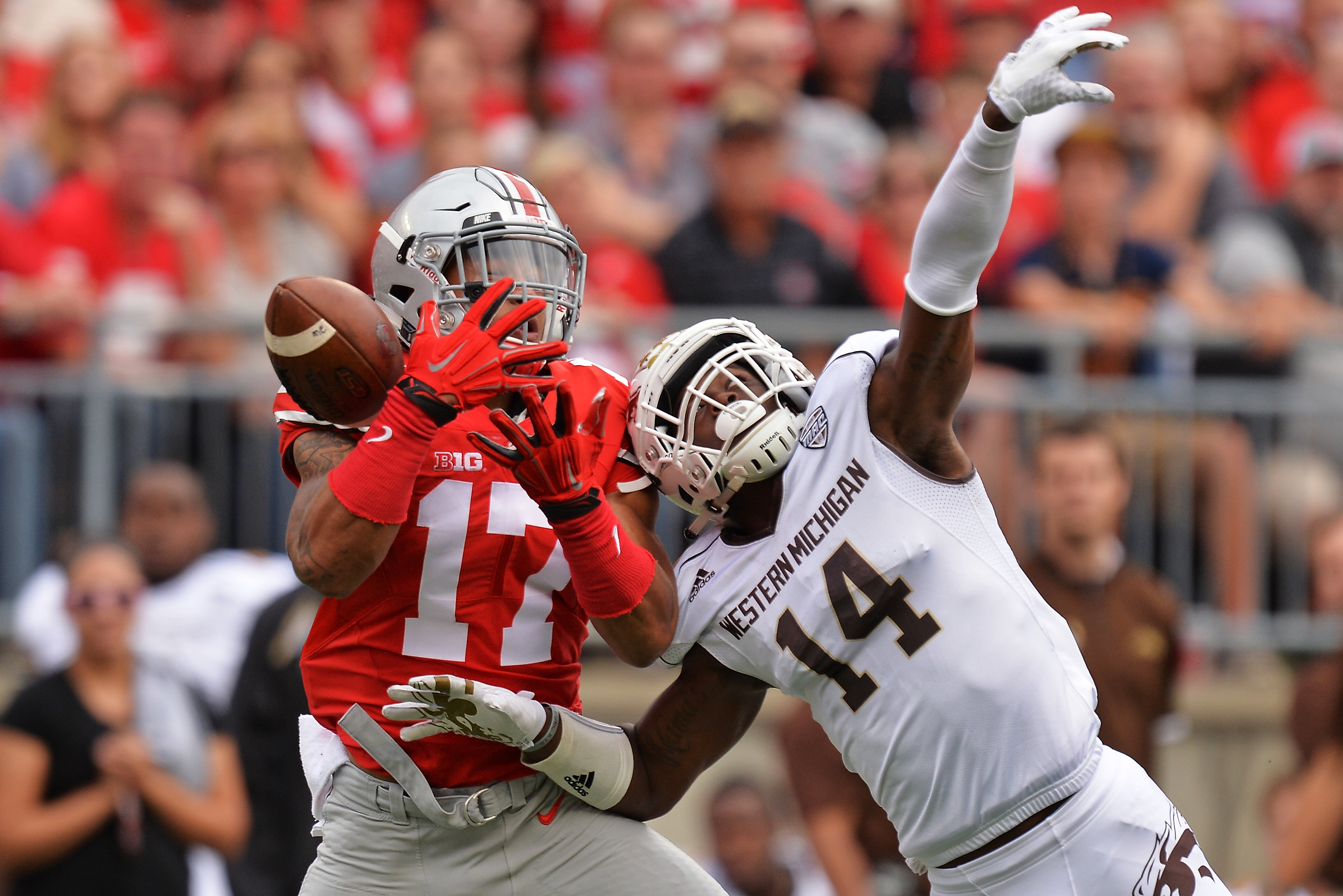 COLUMBUS, OH - SEPTEMBER 26: Darius Phillips #14 of the Western Michigan Broncos breaks up a pass intended for Jalin Marshall #17 of the Ohio State Buckeyes. (Photo by Jamie Sabau/Getty Images)