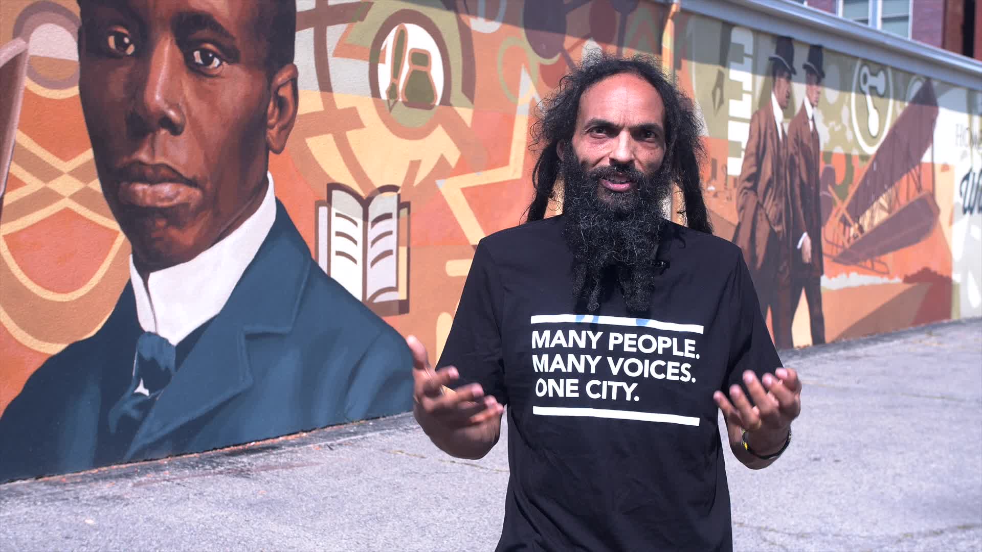 Amaha Sellassie in the Human Relations Council's Many People. Many Voices. One City. T-shirt