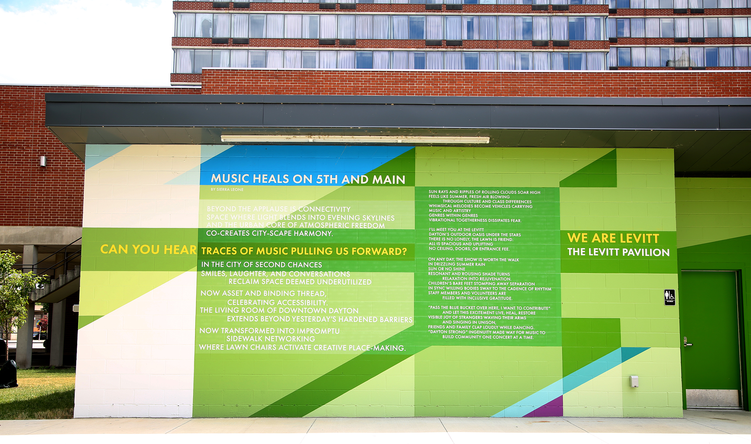 MixedA new mural, with poetry written by Sierra Leone, has been completed at the Levitt Pavilion in Dayton. The poem, “Music Heals on Fifth and Main,” can be read in full on the north side of the building located east of the pavilion. The mural, a combination of bold shapes and bright colors, was designed by Brent Beck and executed by Atalie Gagnet, two local artists. LISA POWELL / STAFF