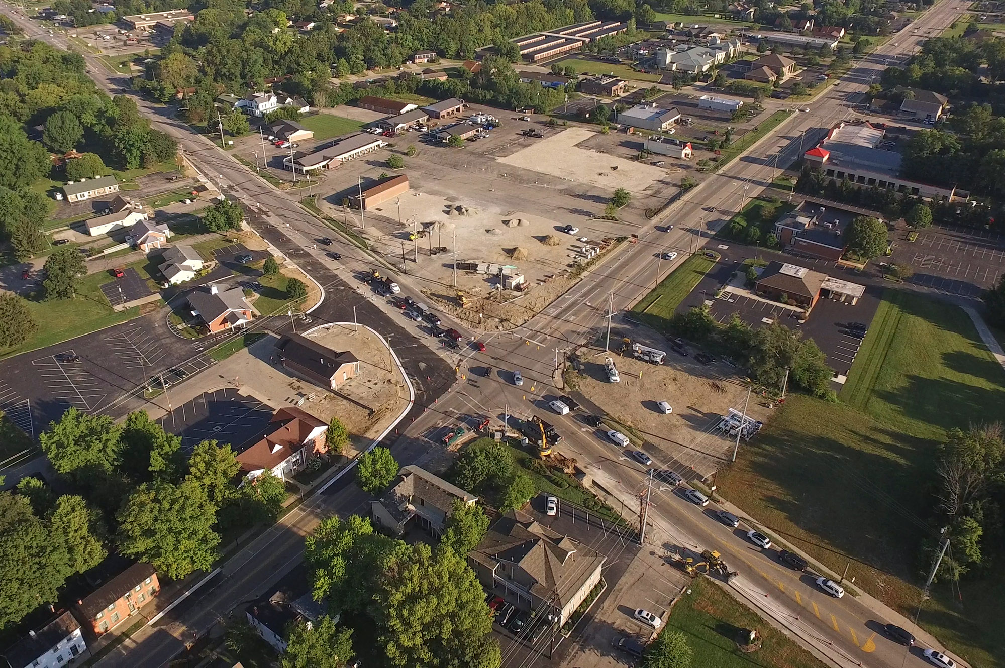 Downtown Springboro is transforming as an old shopping center is razed and a major intersection is widened. TY GREENLEES / STAFF