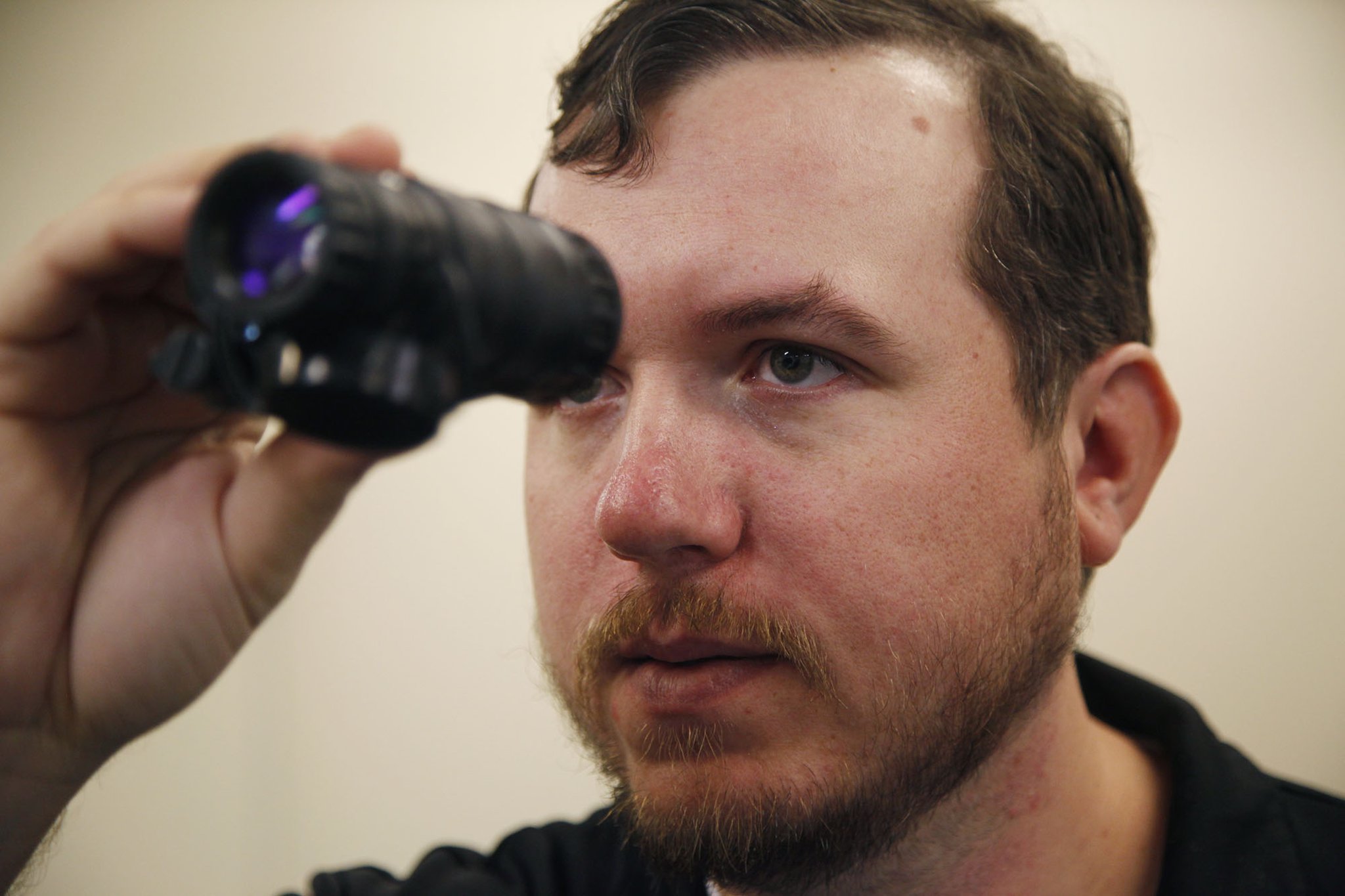 U.S. Army veteran Nick Ripplinger wanted to help his fellow veterans with jobs and help active duty members with useful tools. Ripplinger is the president of Battle Sight Technologies, a company that produces the MARC IR infrared writing stick. The MARC IR is only visible to soldiers wearing night vision goggles, allowing covert written communication in the battle space. Ripplinger uses a night vision scope to test the product in production. TY GREENLEES / STAFF