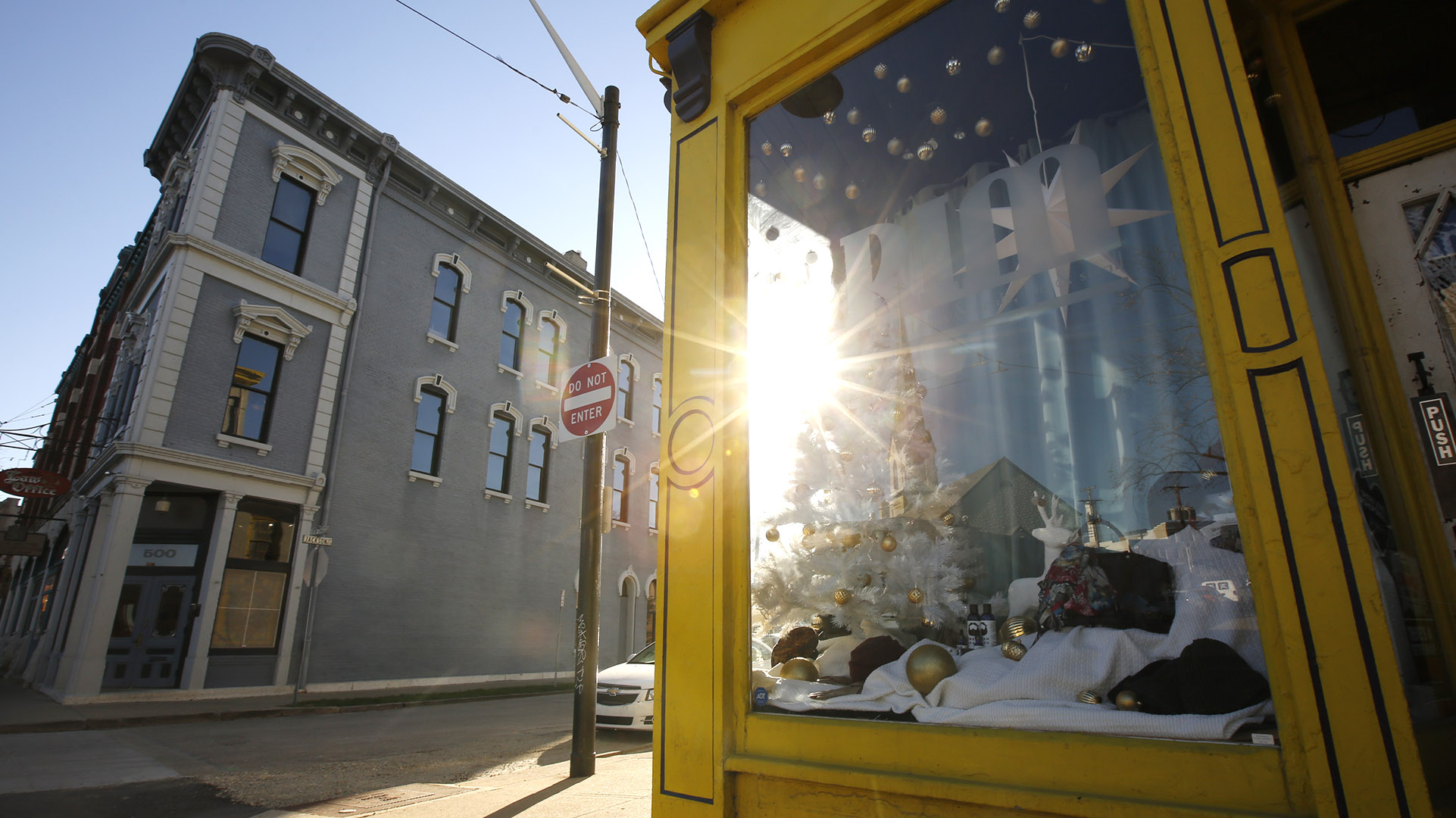 Architecture in the Oregon District is part of allure of historic area. Real showcase windows like this one at BRIM allow for real window shopping. TY GREENLEES / STAFF