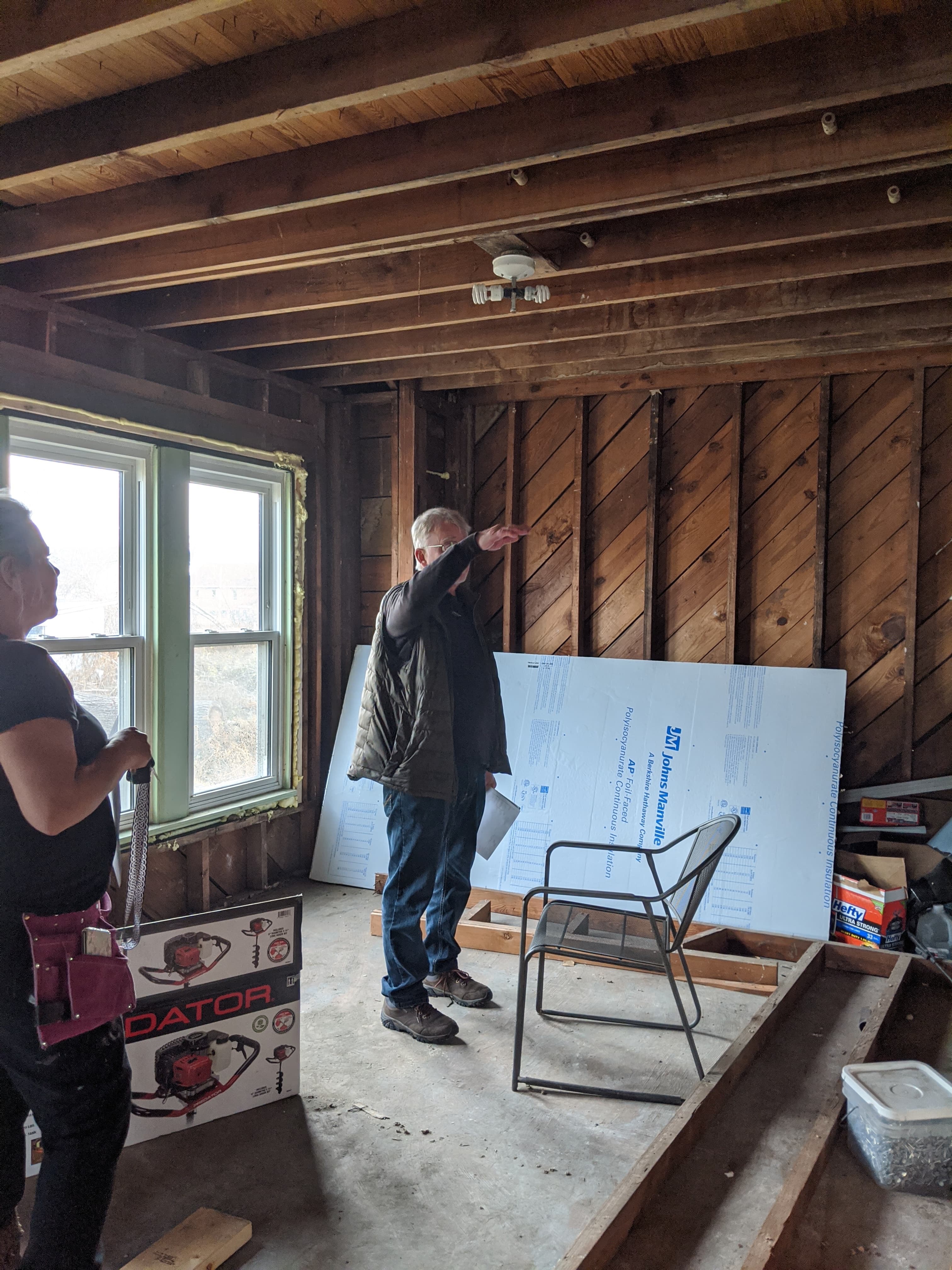 Repair work has continues at Robin and Chris Sassenberg's home (pictured on the right) in Dayton. Much progress has happened since the Memorial Day tornadoes. The couple purchased the home on the left. Chris Sassenberg is pictured in an upstairs space.