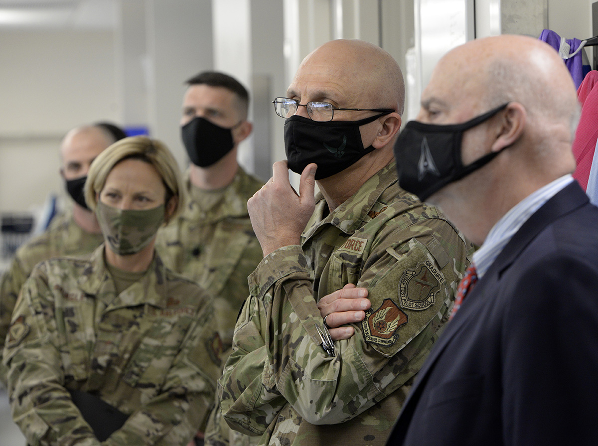 Acting Secretary of the Air Force John Roth, right, and Gen. Arnold W. Bunch Jr., commander, Air Force Materiel Command, listen to a presentation about the U.S. Air Force School of Aerospace Medicine Epidemiology Laboratory at Wright-Patterson Air Force Base, Ohio, March 23, 2021. The lab is responsible for analyzing a majority of the COVID-19 tests in the Air Force. Roth met with Air Force personnel and toured several facilities at the base including the National Air and Space Intelligence Center. U.S. AIR FORCE PHOTO/TY GREENLEES