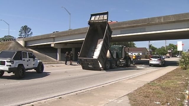 dump truck driver fails to lower bed hits overpass