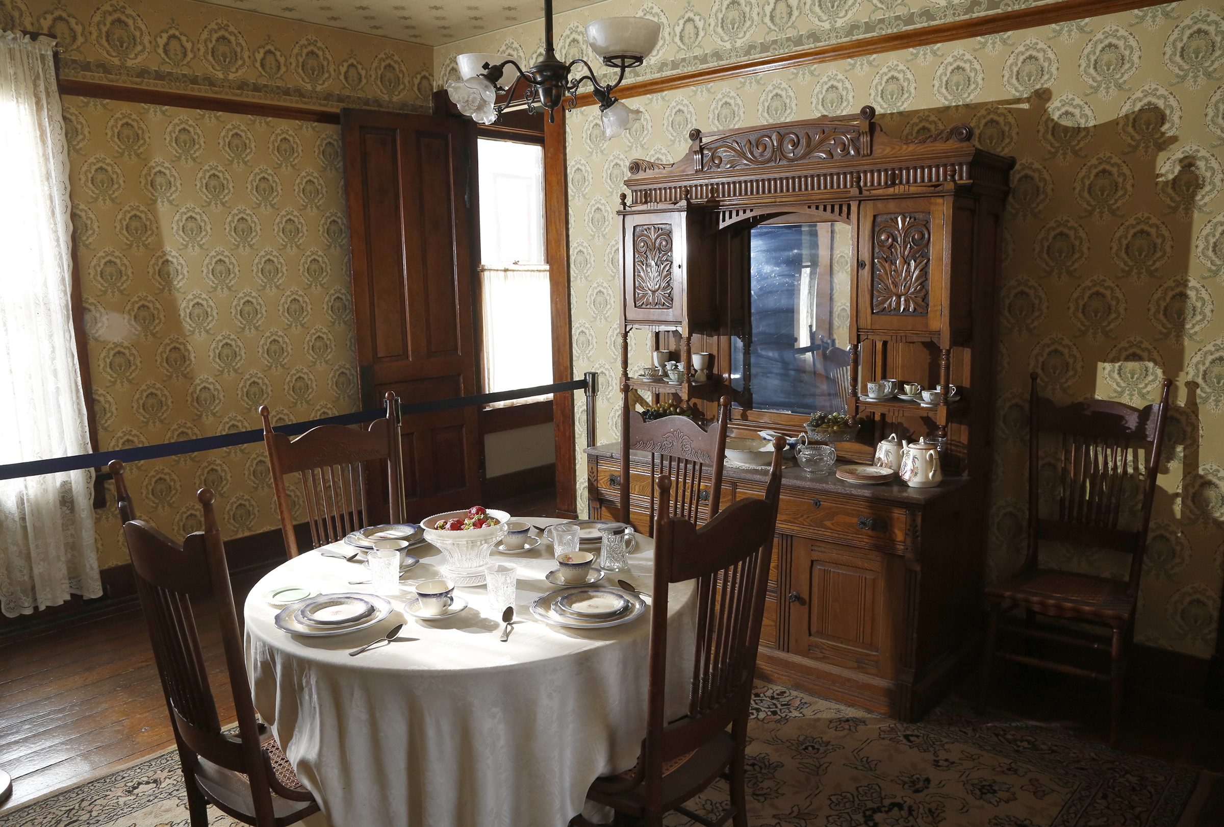 The hutch in the dining room of the Paul Laurence Dunbar house could move away from the wall and the bed folded up in the back.  LISA POWELL / STAFF