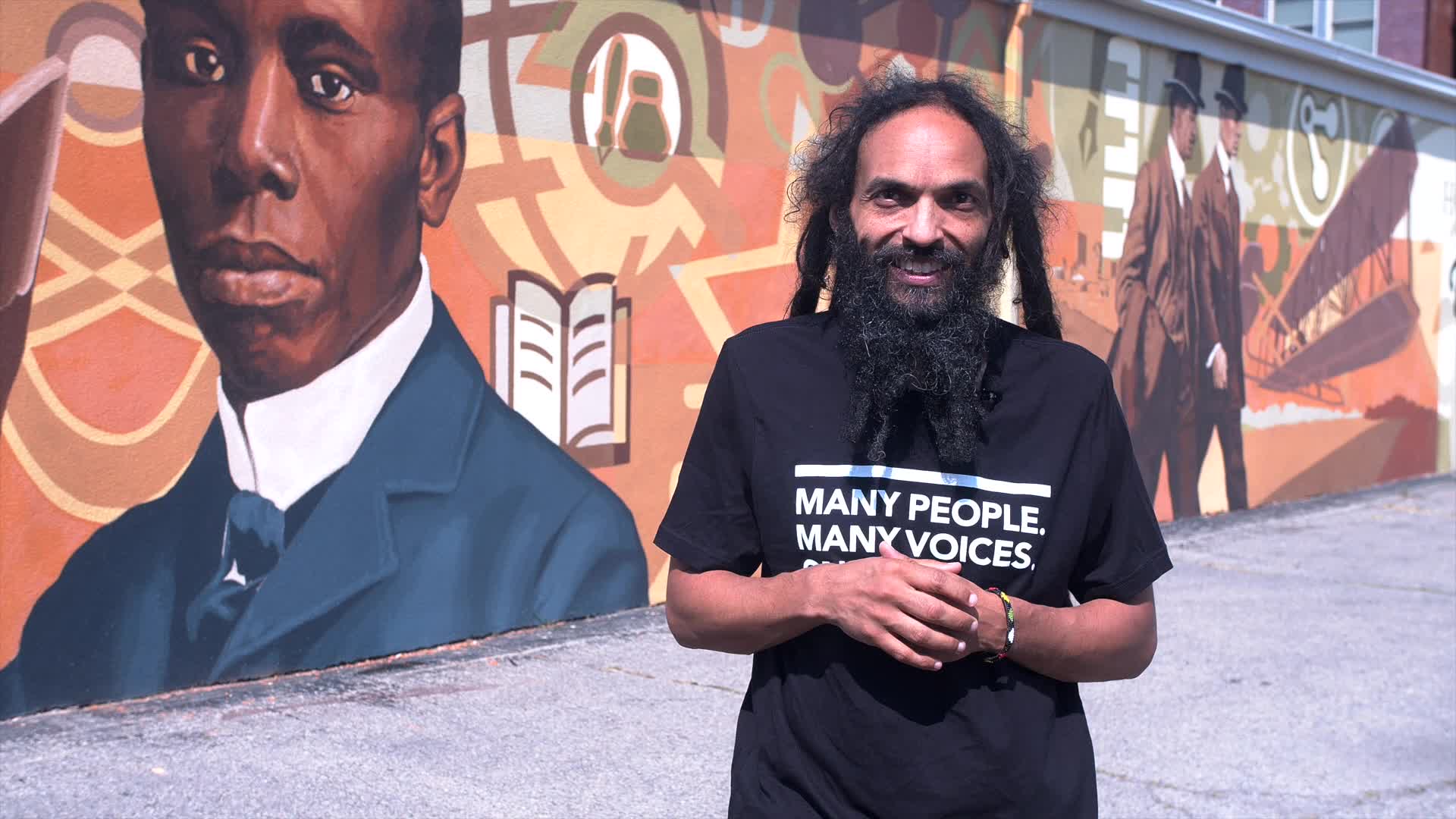Amaha Sellassie in the Human Relations Council's Many People. Many Voices. One City. T-shirt