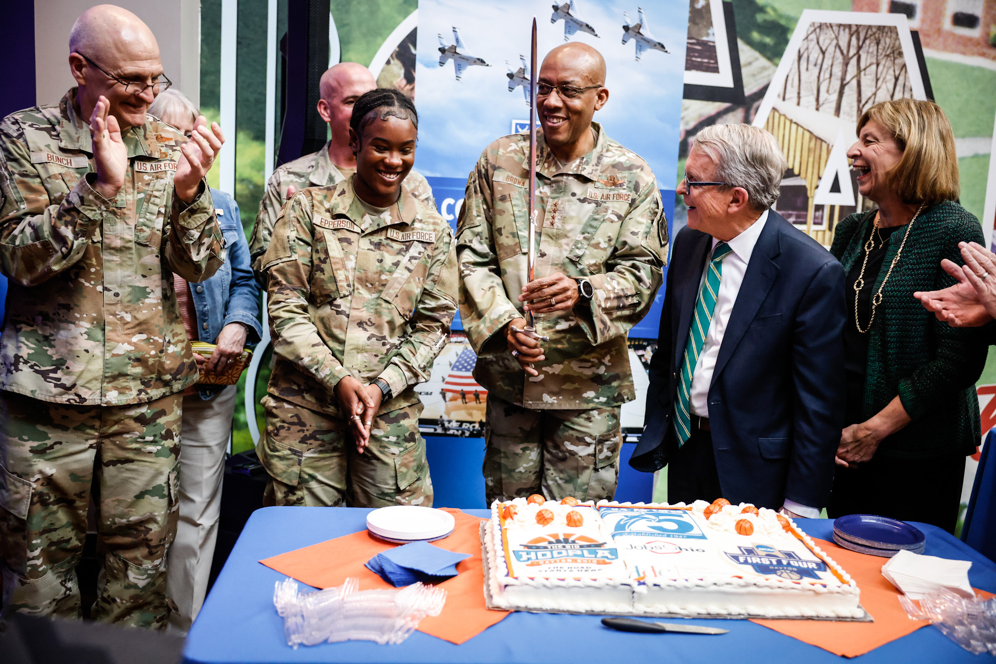 From left, Arnie Bunch, Commander Air Force Materiel Command; Maquaelin Epperson, Airman Basic; Gen. Charles Q. Brown and Gov. Mike DeWine and his wife Fran DeWine, cut the 75th Anniversary of the Air Force cake at the HOOPLA event held at Carillon Park. Jim Noelker/Staff
