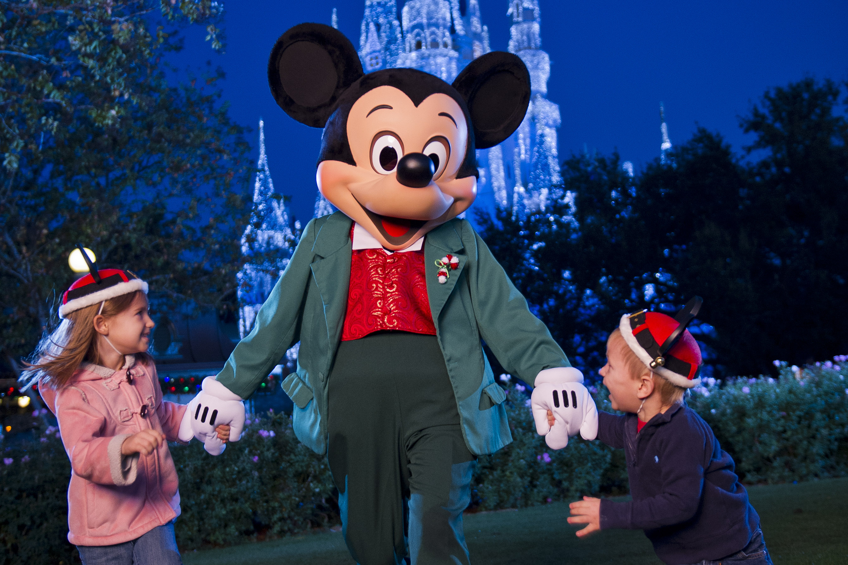 Mickey Mouse presides over the holiday festivities during Mickey's Very Merry Christmas Party at Magic Kingdom in Lake Buena Vista, Fla. This enchanting after-hours party showcases special entertainment, including "Mickey's Once Upon a Christmastime Parade" and a holiday edition of the fireworks spectacular "Wishes," as well as meet-and-greet opportunities with favorite Disney characters in holiday attire. (Matt Stroshane, photographer)