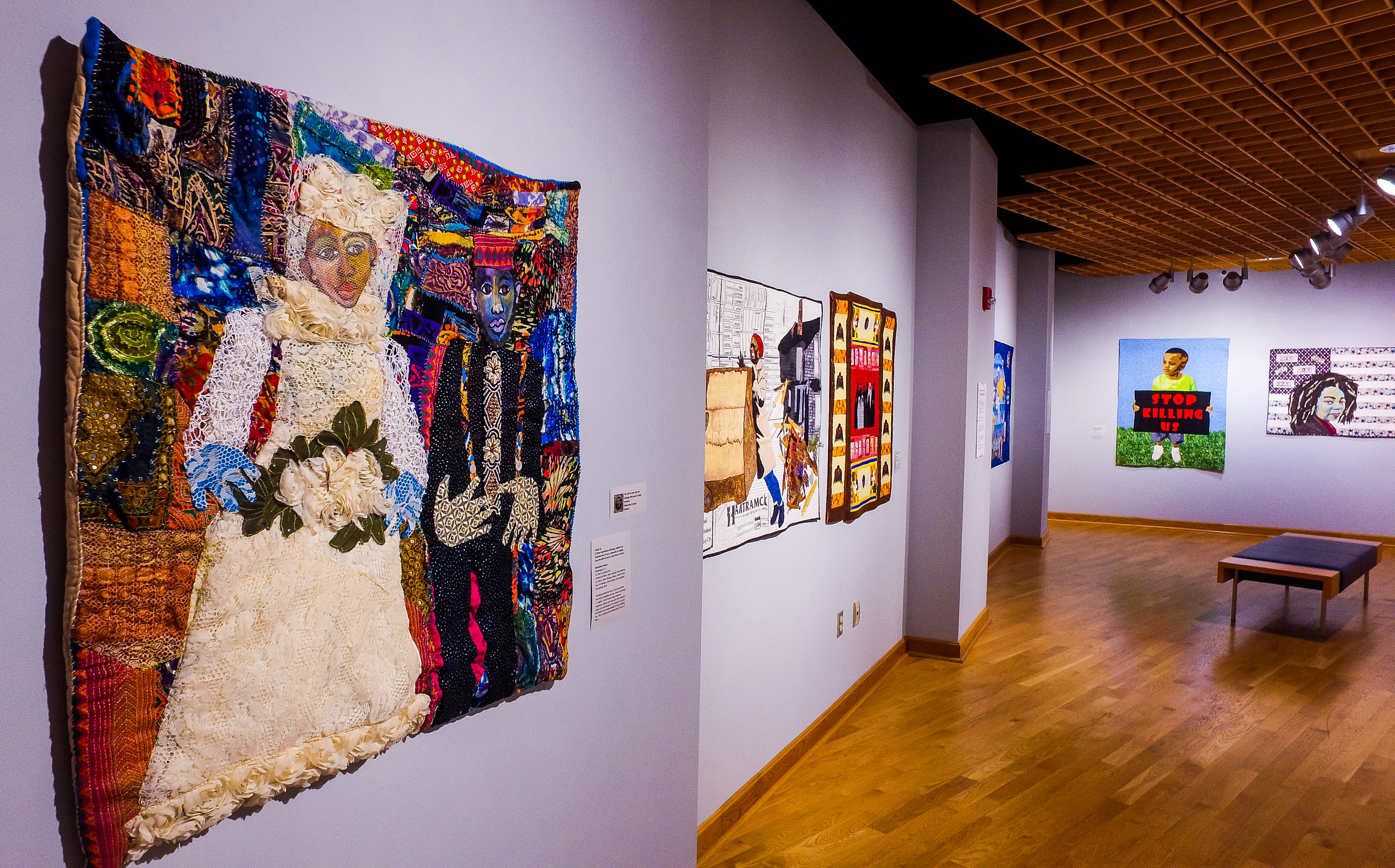 The exhibition "Visioning Human Rights in the New Millennium: Quilting the World's Conscience" at the Fitton Center features narrative art quilts inspired by the United Nations Declaration of Human Rights.
