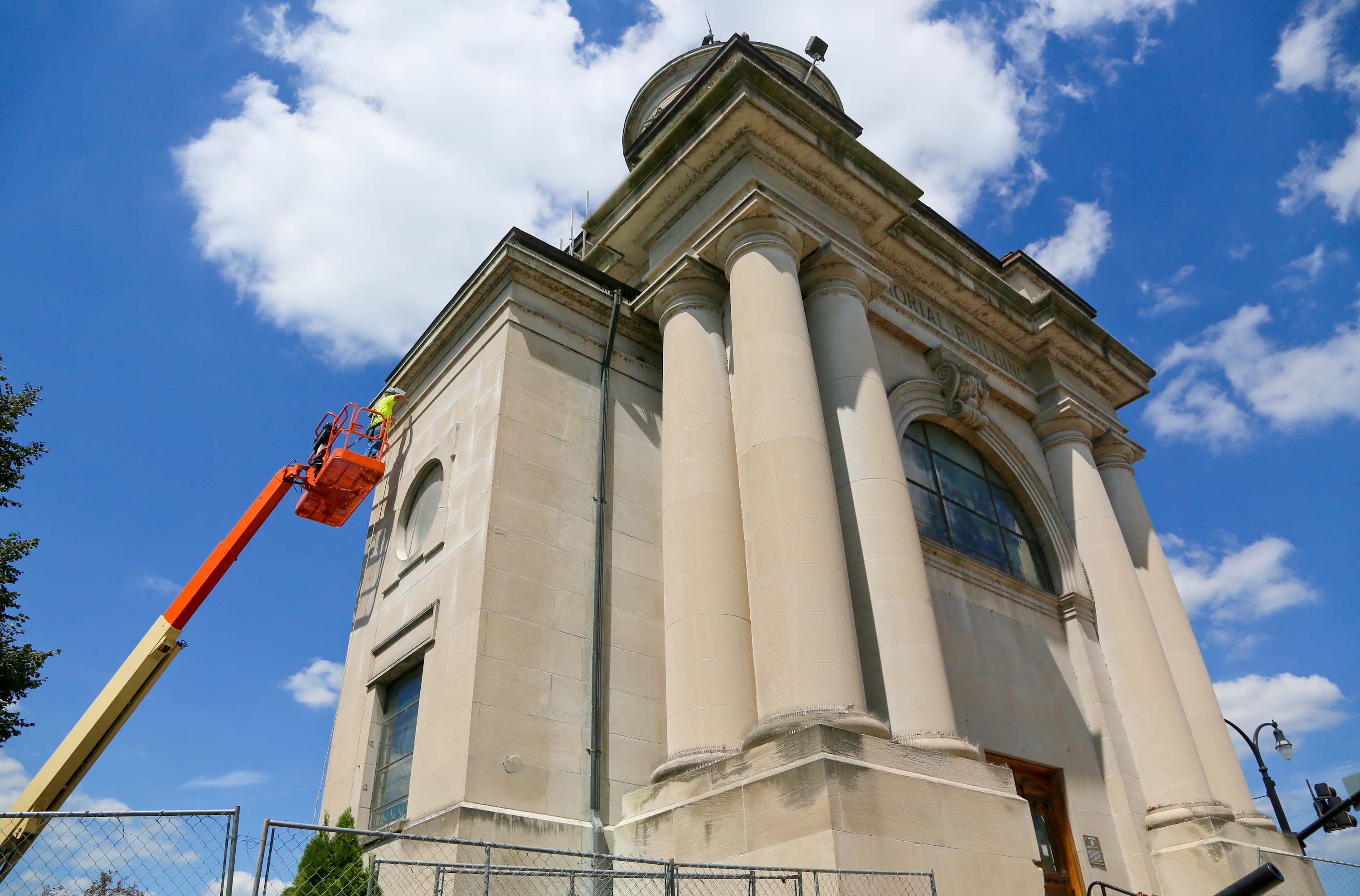 Bob Snow of Lee Restoration works on the Soldiers, Sailors, and Pioneers monument last August in downtown Hamilton.