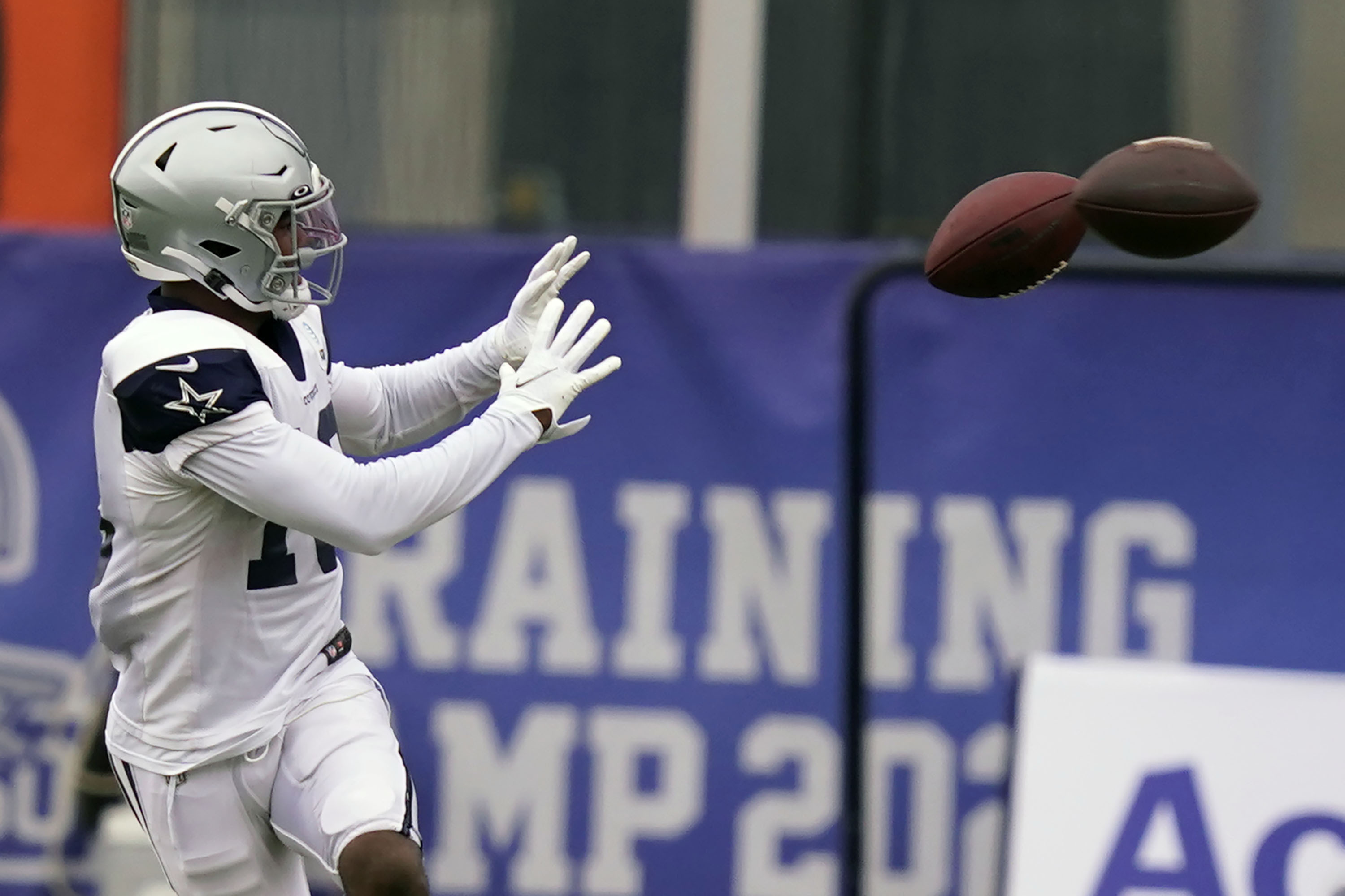 Dallas Cowboys wide receiver Aaron Parker (18) reaches for pass during an NFL training camp football practice in Frisco, Texas, Thursday, Sept. 3, 2020. (AP Photo/LM Otero)