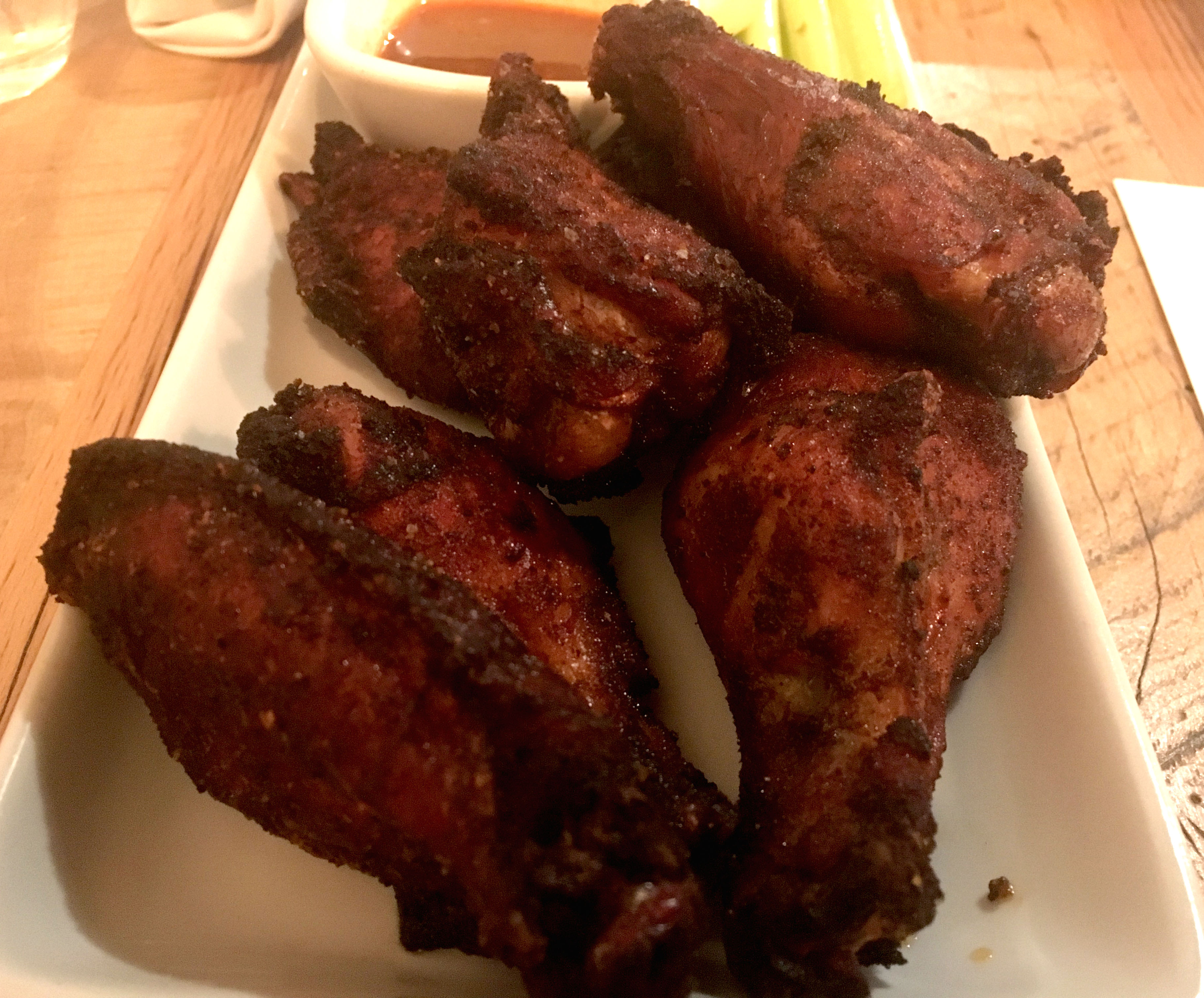 The food at Lock 27 in downtown Dayton. Pictured: smoked chicken wings with a sriracha blue cheese and a hot sauce. Photo by Amelia Robinson
