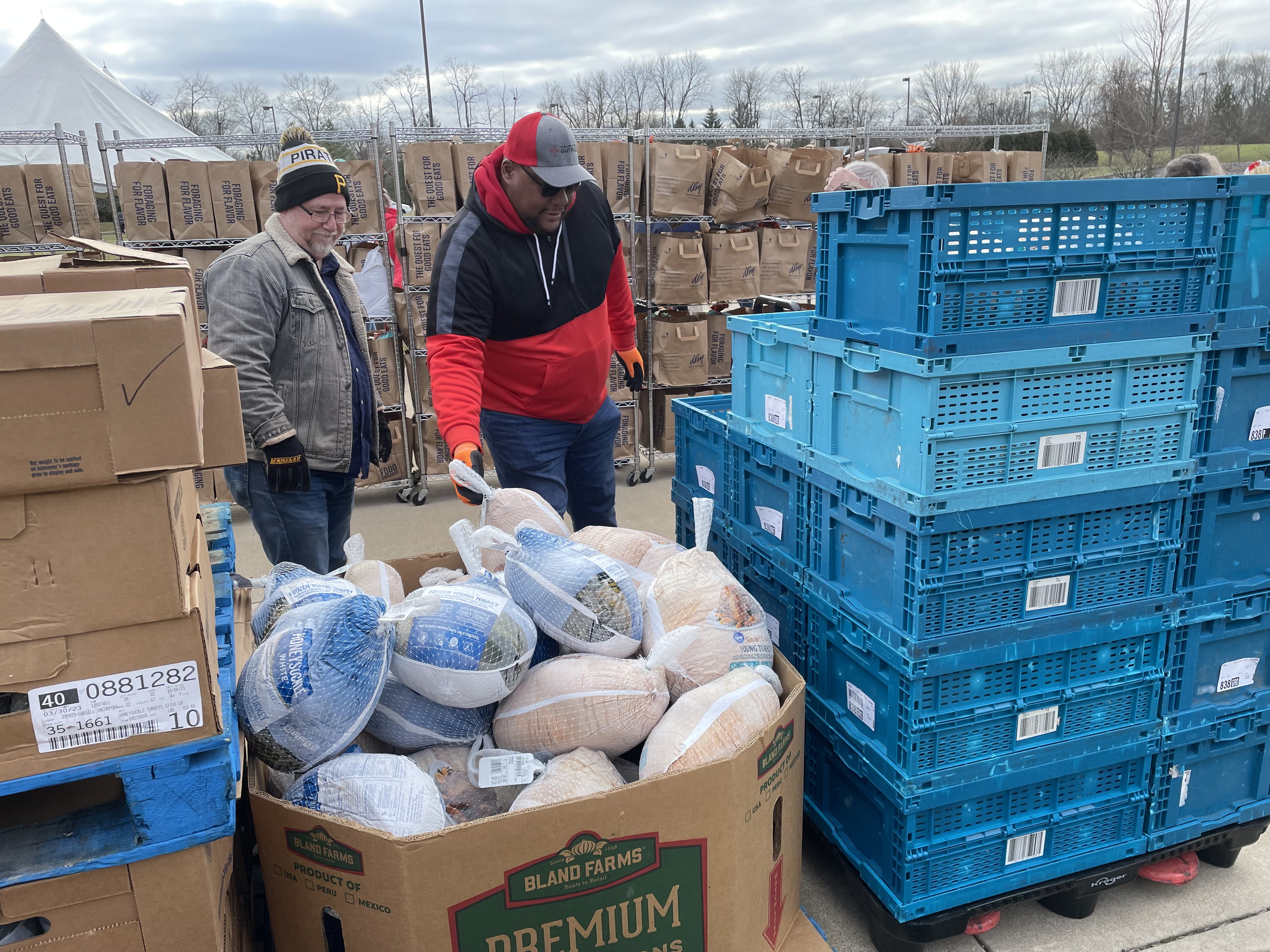 Volunteers at Dayton Vineyard Church gave away hundreds of Christmas dinner kits Sunday.