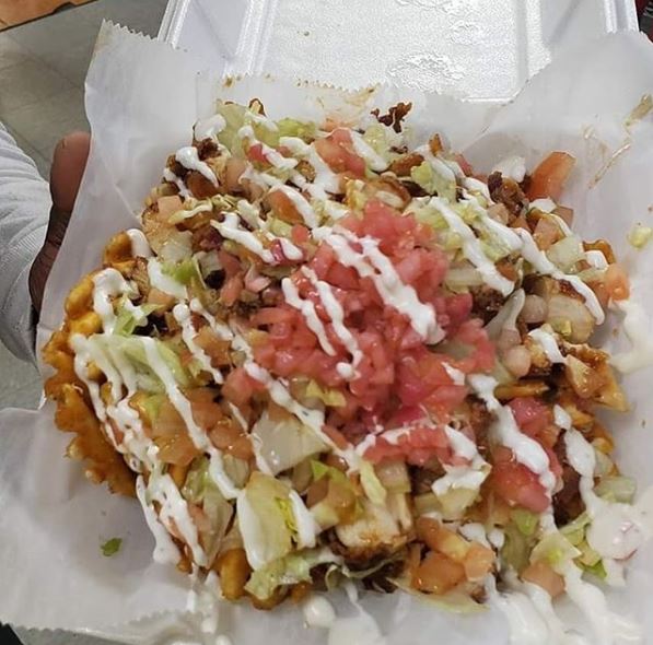 Chicken Spots' loaded fries comes with a list of sloppy toppings that can includes choice of two sauces, chopped chicken tenders, crispy bacon, shredded romaine lettuce, chopped tomatoes and pickled onions. Mac and cheese and greens can be added for $2 each.
