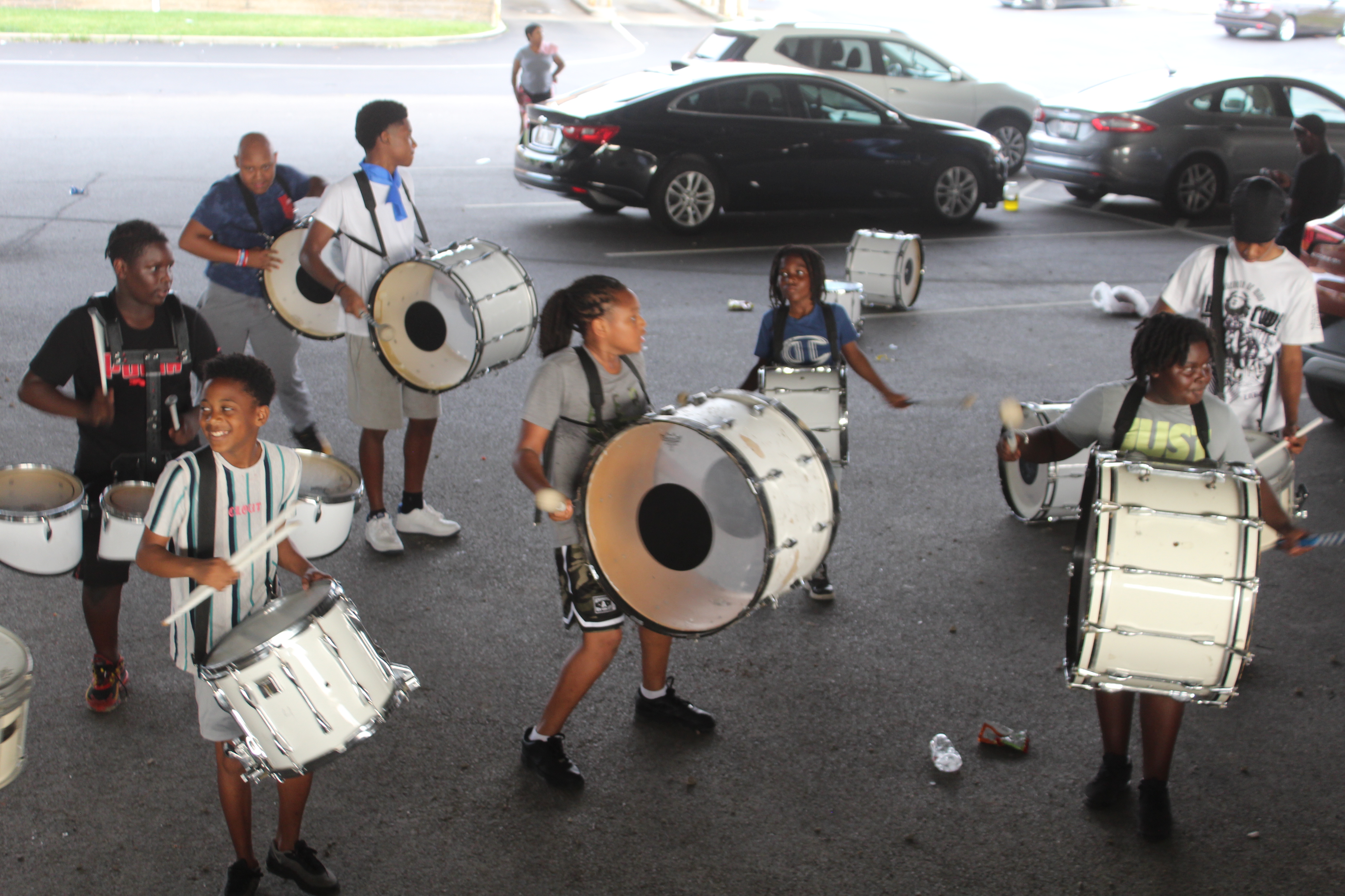 Members of the Western Stars Drill Team & Drum Line practice in a parking lot in downtown Dayton.  CORNELIUS FROLIK / STAFF