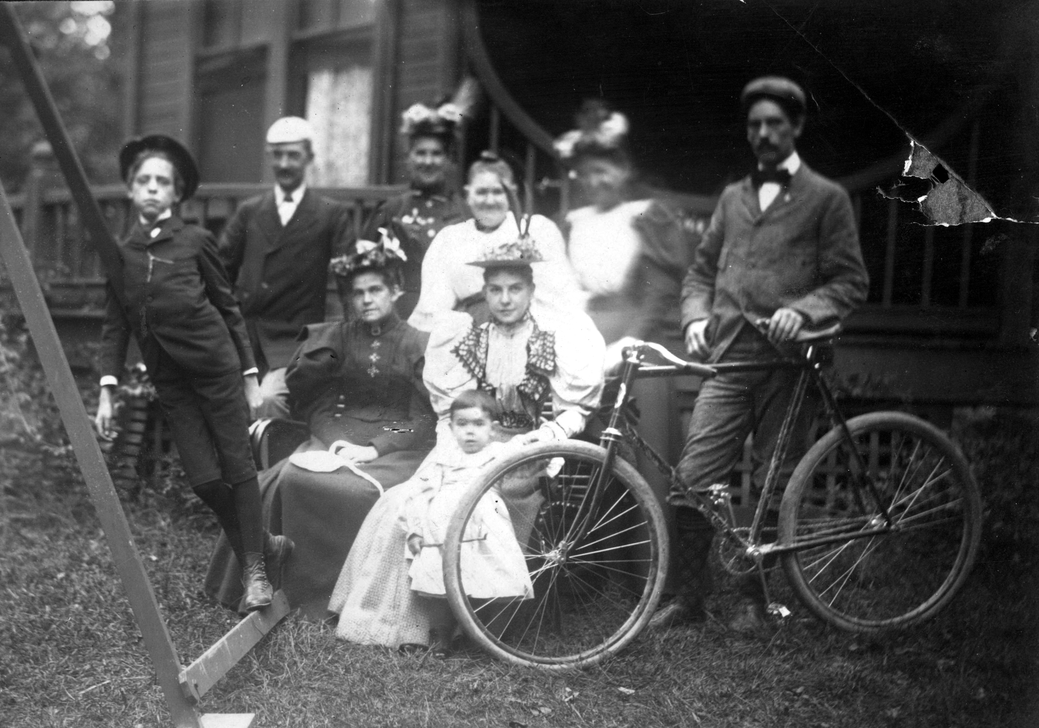 Friends and family pose for a photograph with a bicycle in 1895 at the Best Cottage in Dayton. The cottage was located at Idlewyld, the Best estate that later became Triangle Park. DAYTON METRO LIBRARY / LUTZENBERGER PICTURE COLLECTION