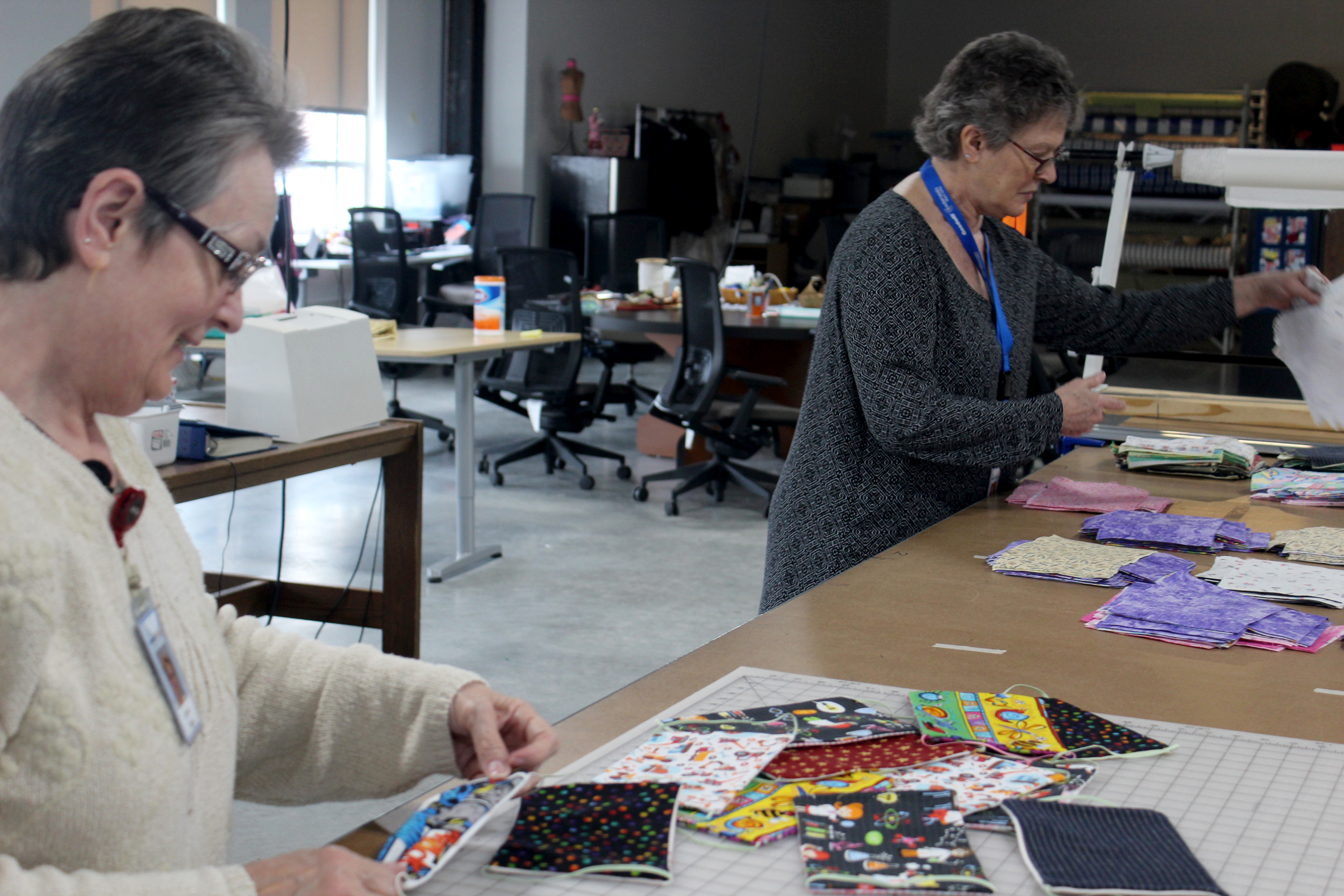 Since Friday, March 20, Dayton Sewing Collaborative volunteers in homes around the community have made hundreds of reusable face mask for local organization who need them as worries mount of the coronavirus. Volunteers Tursia Turner (left) and Bonnie Craigo are pictured.