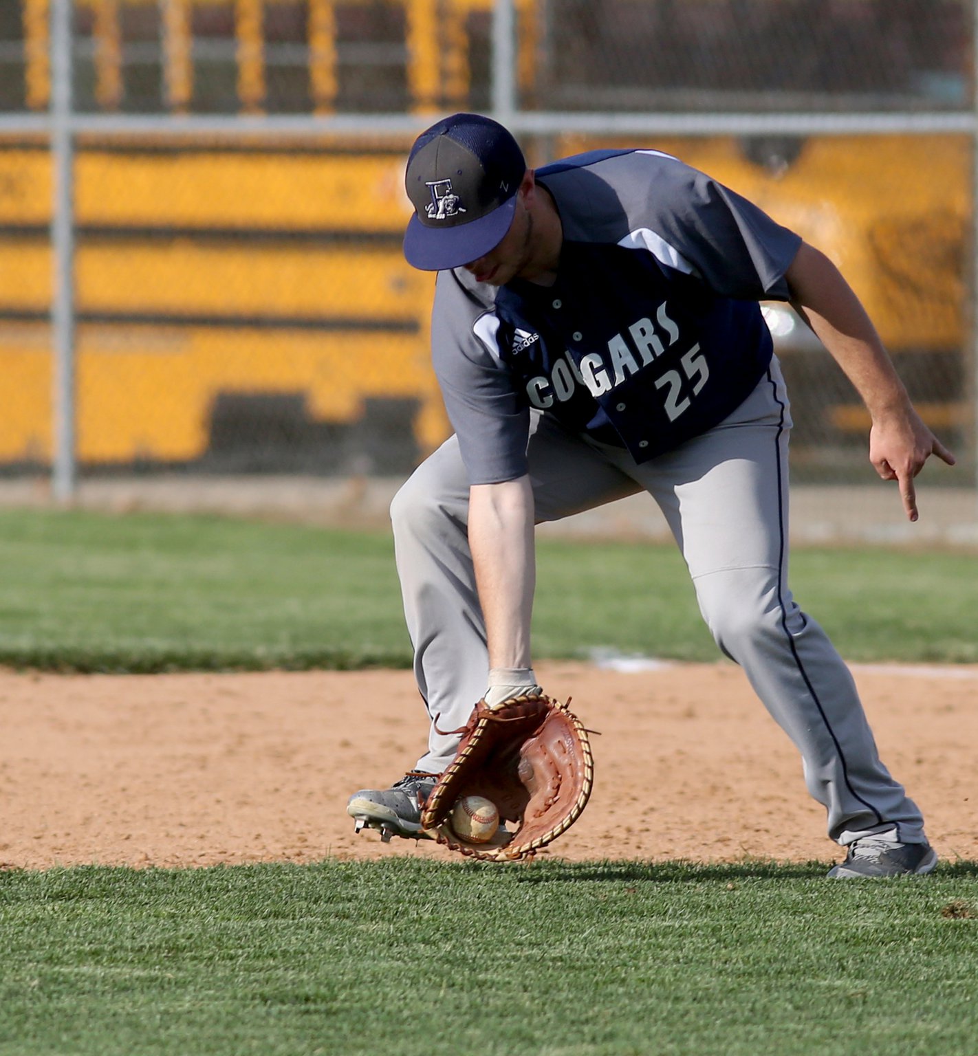 Edgewood first baseman Jacob Hauser scoops up a Ross ground ball during their game at RHS on Wednesday. CONTRIBUTED PHOTO BY E.L. HUBBARD