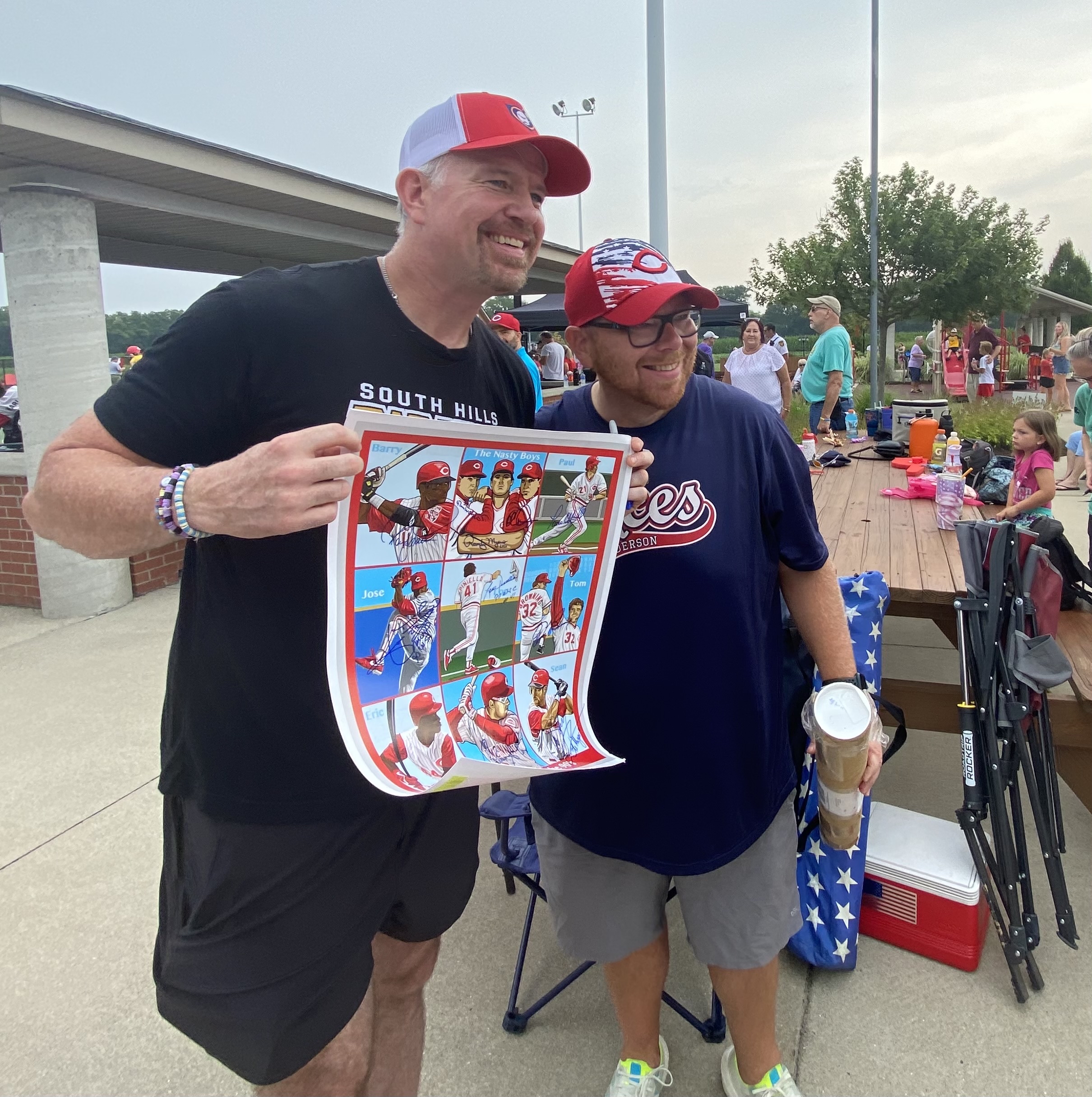Sean Casey is the last autograph this Cincinnati Reds fan needed on this poster featuring Reds Legends of the ‘90s. Casey was at Joe Nuxhall Miracle League Fields on Saturday, July 23, 2022, with a group of players from his Miracle League of the South Hills in Pittsburgh. MICHAEL D. PITMAN/STAFF