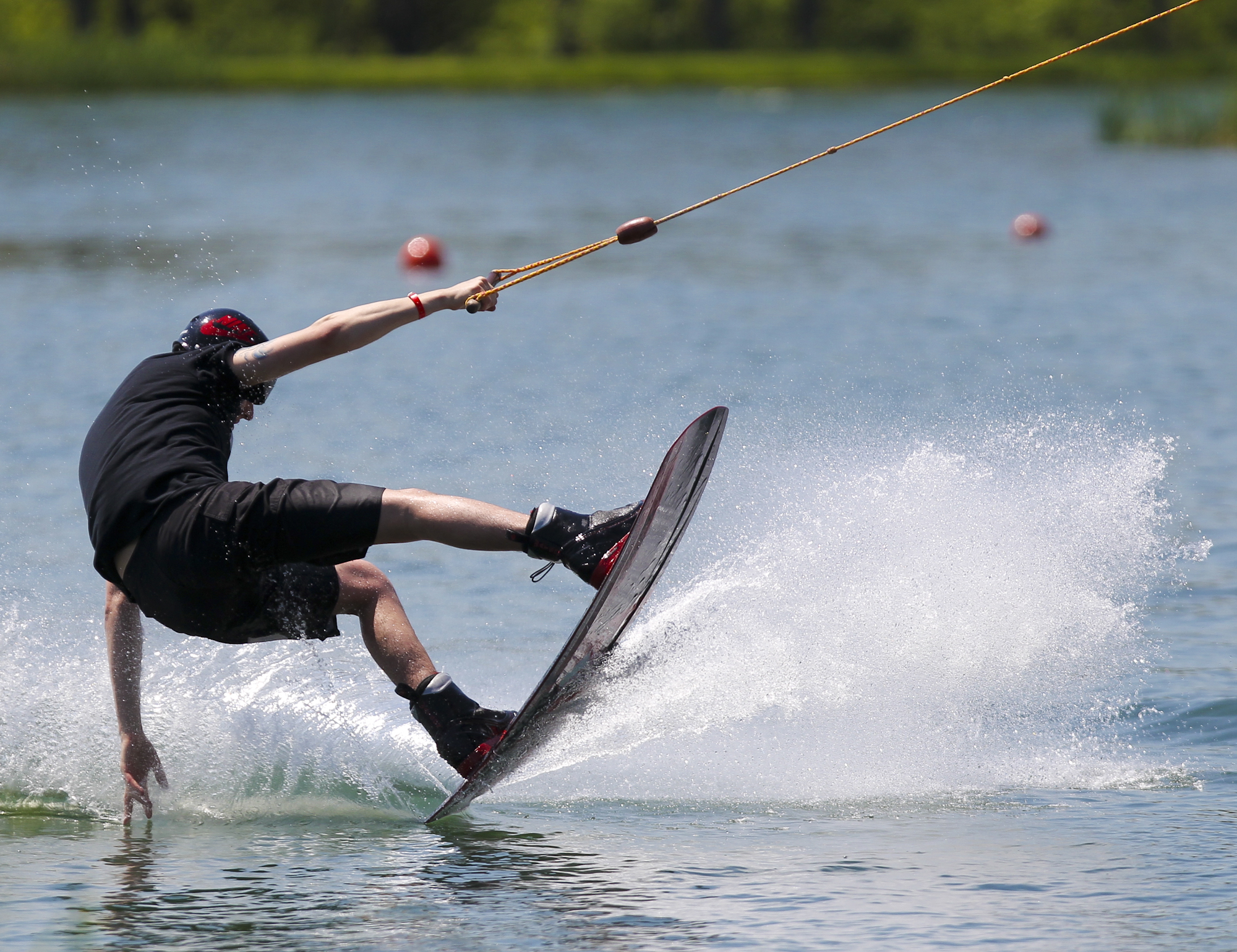 Wake Nation Cincinnati, the cable wakeboarding complex in Fairfield's Joyce Park. At Wake Nation Cincinnati riders can wakeboard, water ski, kneeboard, and wake skate around a 10-acre lake without a boat. Riders are pulled around the oval lake at speeds of 18-20 miles per hour by a circulating, overhead cable system that runs 35 feet above the water. GREG LYNCH / STAFF
