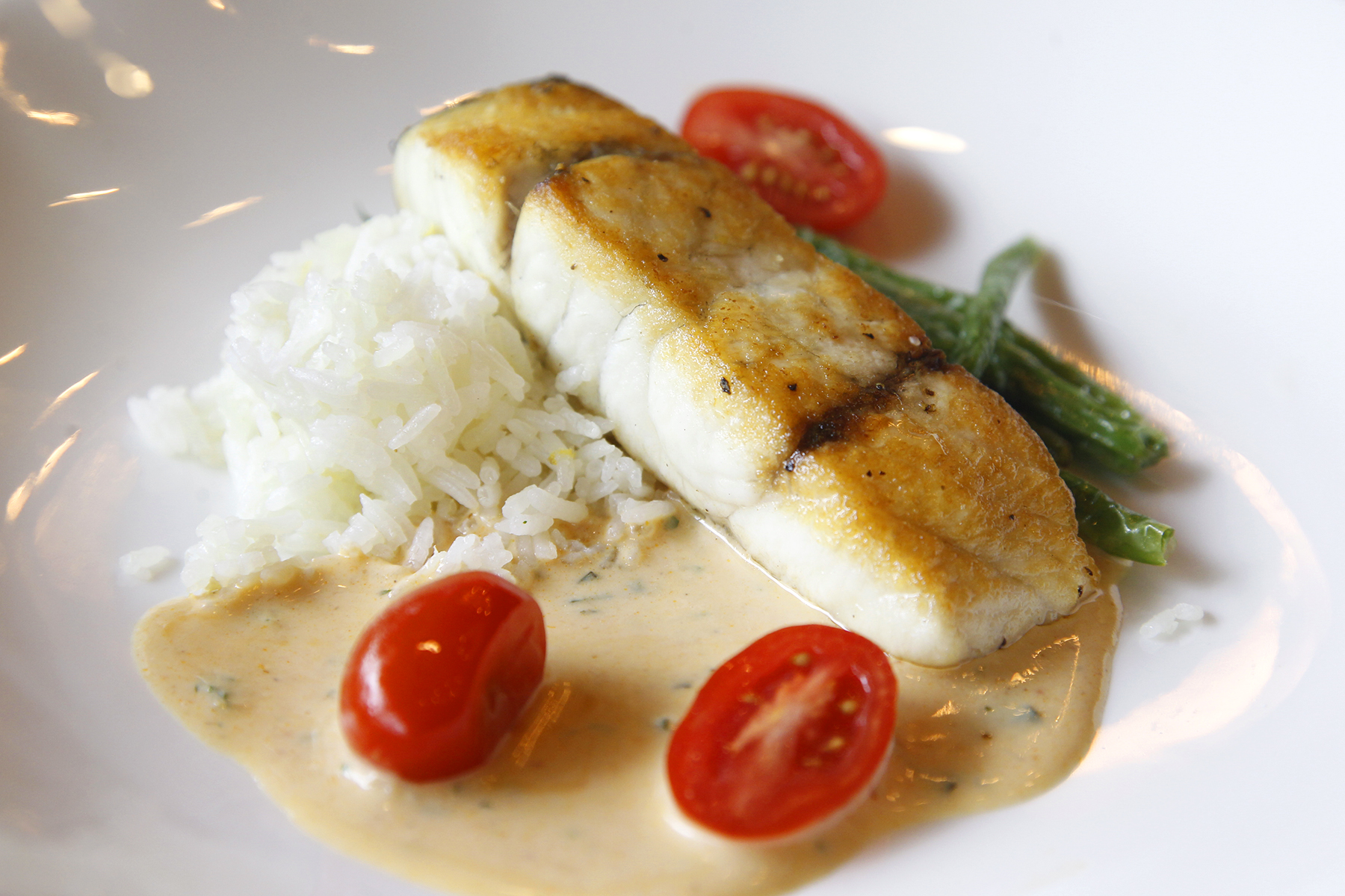 Cooperâs Hawk Winery & Restaurant, located in the Cornerstone of Centerville, opens Monday, Aug. 26. Pan-roasted barramundi with blistered green beans, grape tomatoes, ginger rice and Thai lemongrass sauce is one of the entrees on the menu. LISA POWELL / STAFF