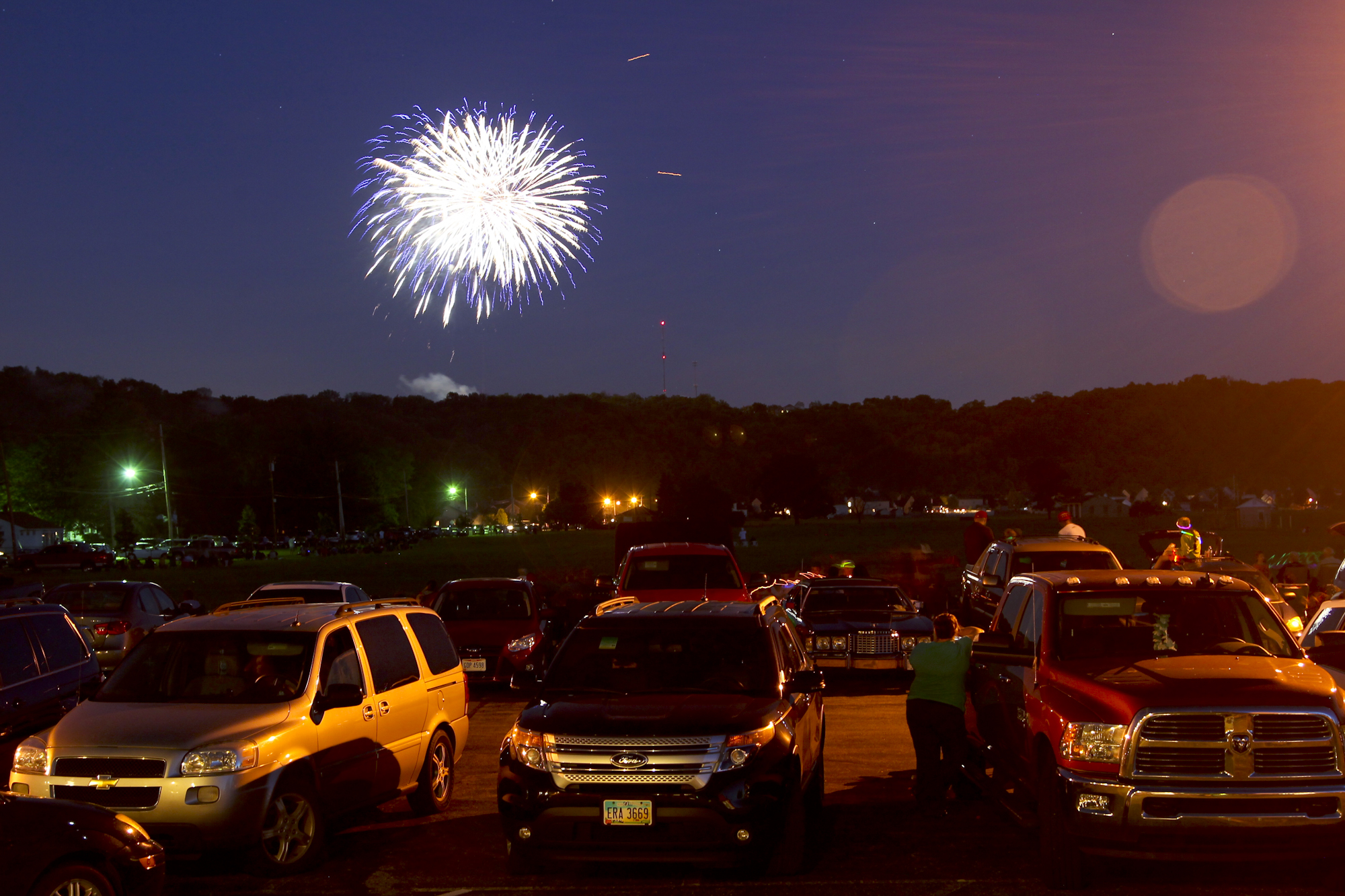 Spectators watch from Fairfield West Baptist Church as Rozzi's Famous Fireworks fill the sky in Fairfield during the Red White and Kaboom celebration, Friday, July 3, 2014. GREG LYNCH / STAFF