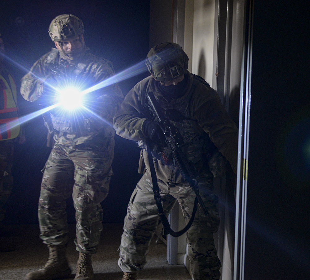Members of the 88th Security Forces Squadron clear a building during an active-shooter exercise at Wright-Patterson Air Force Base on Feb. 24. U.S. AIR FORCE PHOTO/WESLEY FARNSWORTH