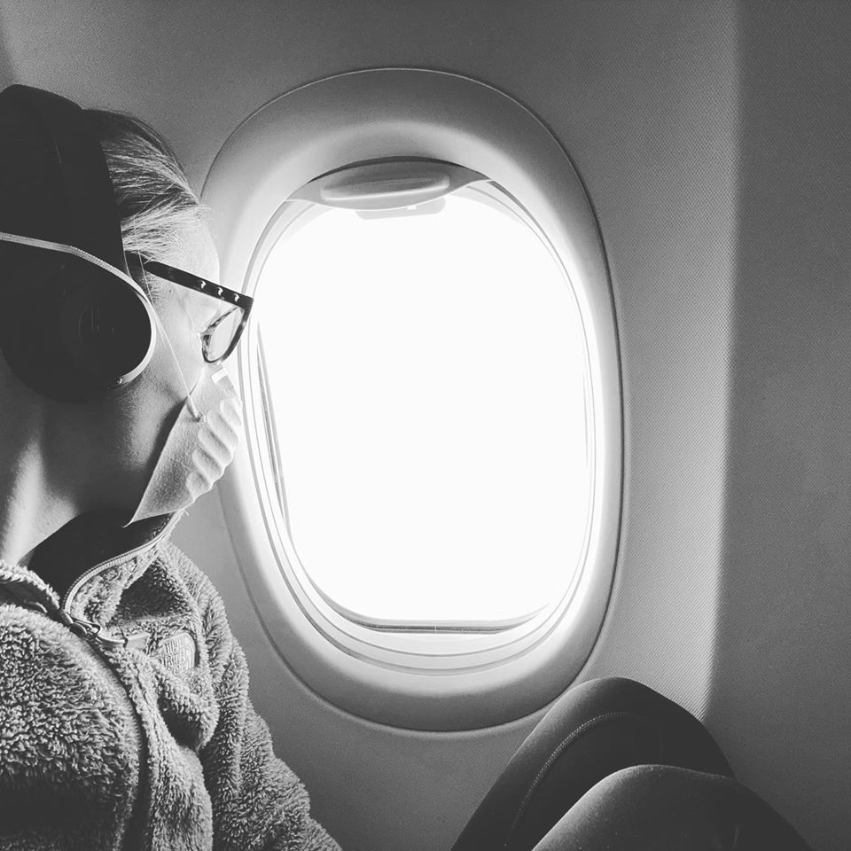 Clayton registered nurse Staci Hedke began a three week stint to help fight the coronavirus in New York. Hedke is pictured on the plane to New York.