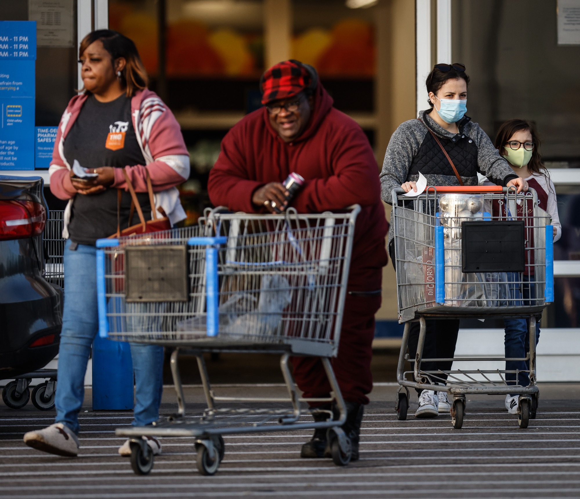 Walmart customers leave the store on South Dixie Drive in Kettering, some wearing masks and some not. More than 4,000 people with COVID-19 were hospitalized in Ohio for the third day in a row. The last time more Ohioans were being treated in the hospital for COVID was on Jan. 12. Jim Noelker/Staff