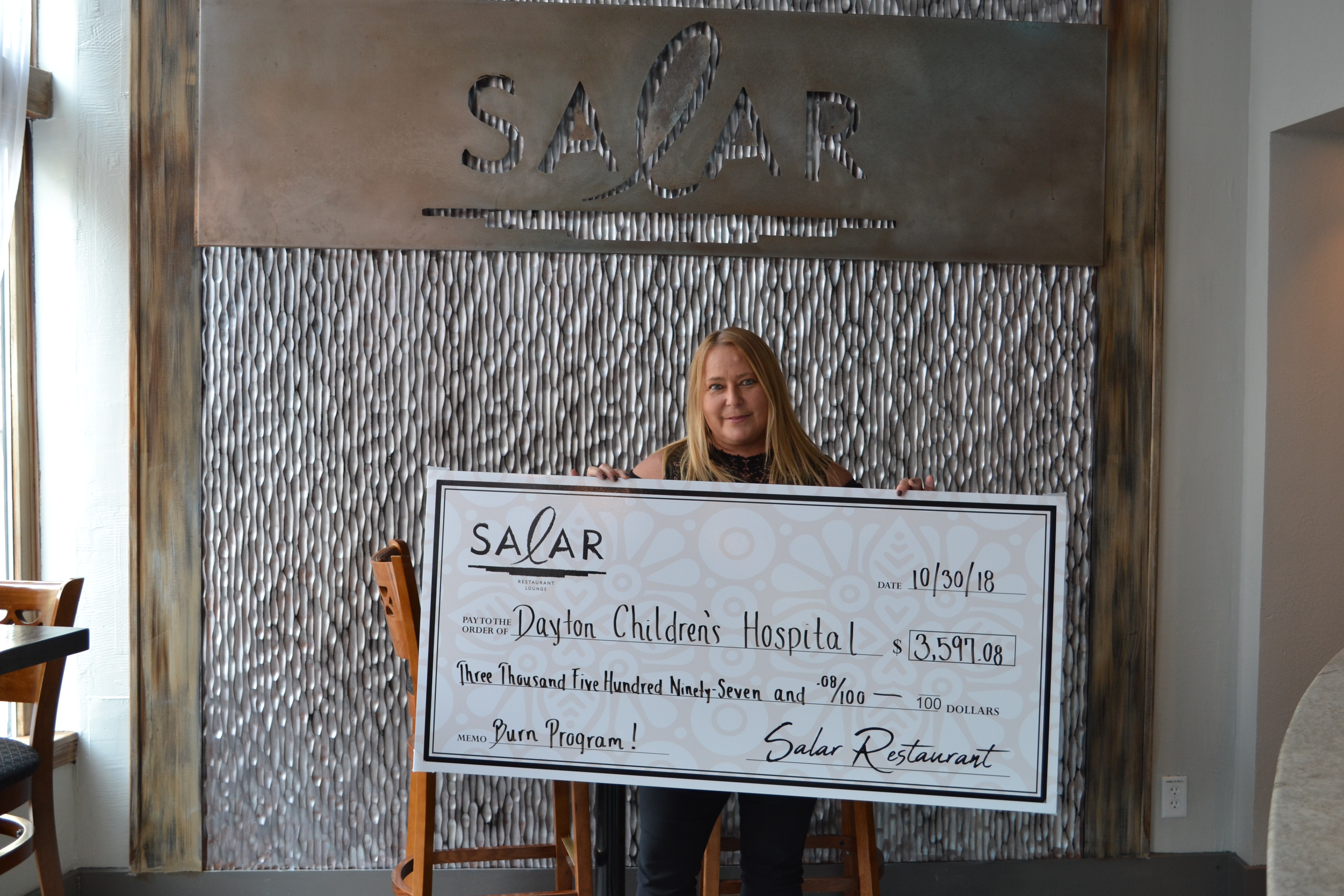 Salar Restaurant and Lounge, 400 E. Fifth St. in Dayton’s Oregon District, has donated $3,600 to Dayton Children’s Hospital Burn Program.